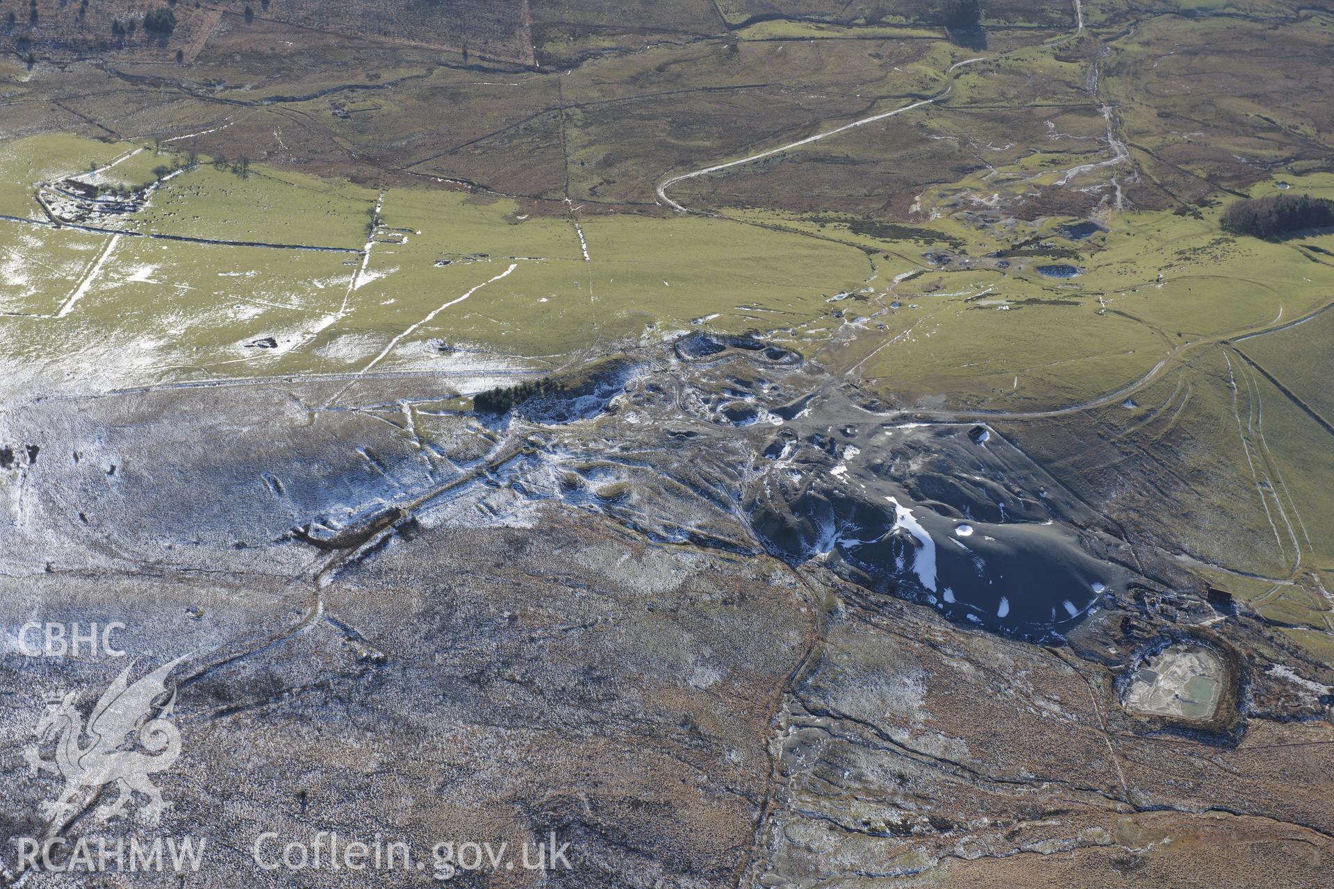 Esgairmwyn Lead Mine, its spoil tip and reservoir, near Pontrhydfendigaid. Oblique aerial photograph taken during the Royal Commission's programme of archaeological aerial reconnaissance by Toby Driver on 4th February 2015.