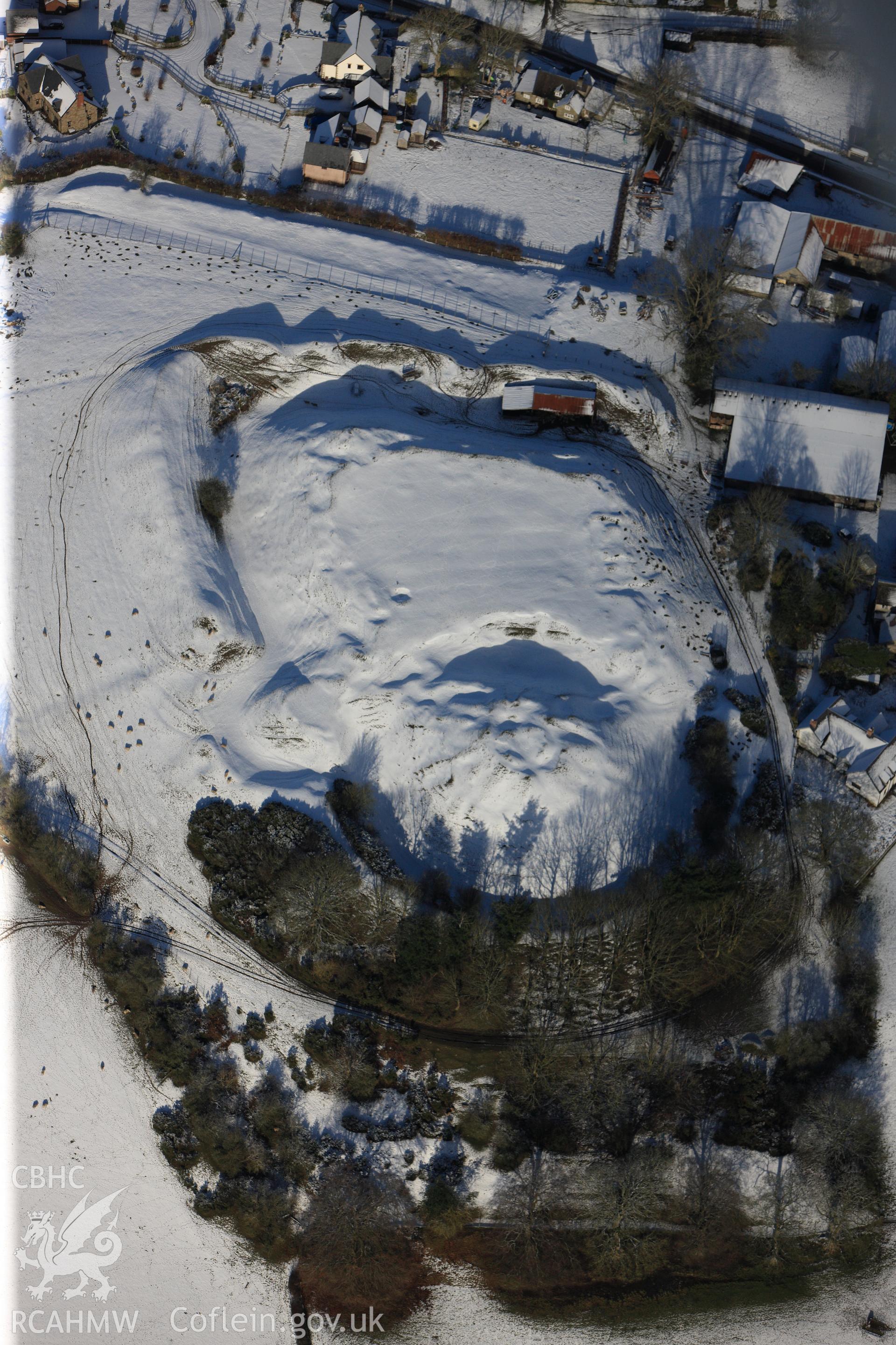 Motte and bailey castle at Painscastle, south east of Builth Wells. Oblique aerial photograph taken during the Royal Commission?s programme of archaeological aerial reconnaissance by Toby Driver on 15th January 2013.