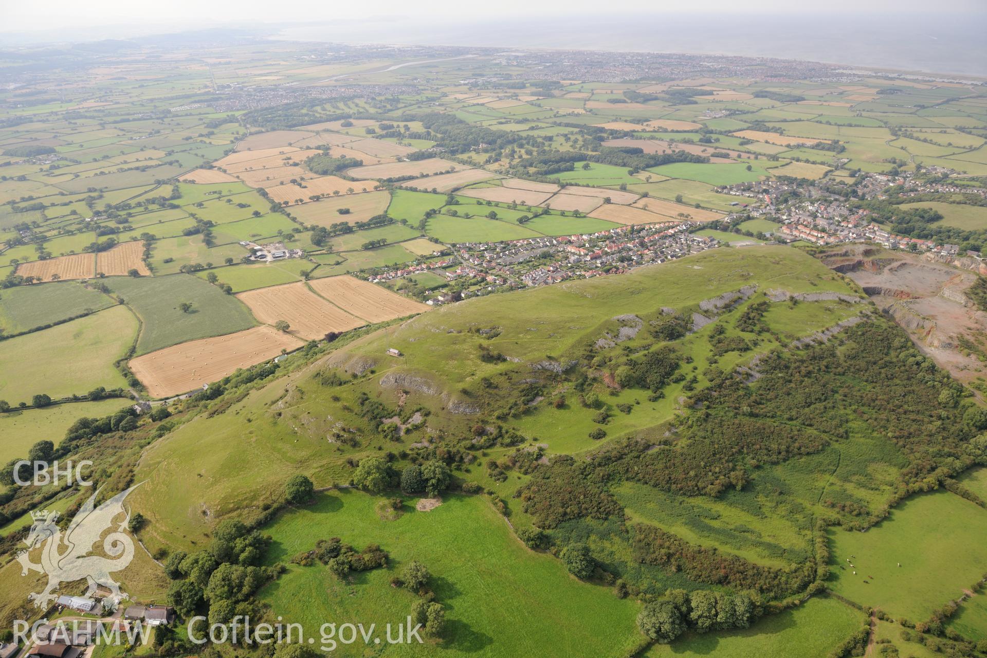 Moel Hiraddug Camp and the site of Moel Hiraddug Mounrain iron ore and cobalt mine, Dyserth, near St. Asaph. Oblique aerial photograph taken during the Royal Commission's programme of archaeological aerial reconnaissance by Toby Driver on 11th September 2015.