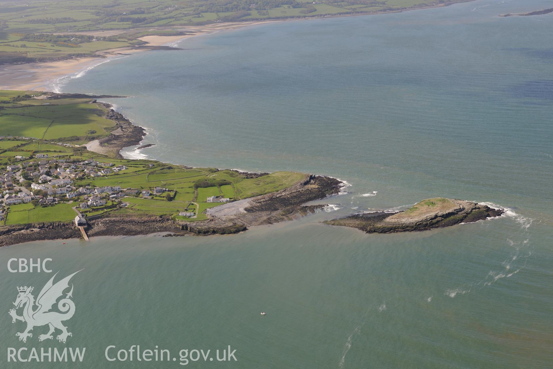 Moelfre, and the enclosure on Ynys Moelfre. Oblique aerial photograph taken during the Royal Commission?s programme of archaeological aerial reconnaissance by Toby Driver on 22nd May 2013.