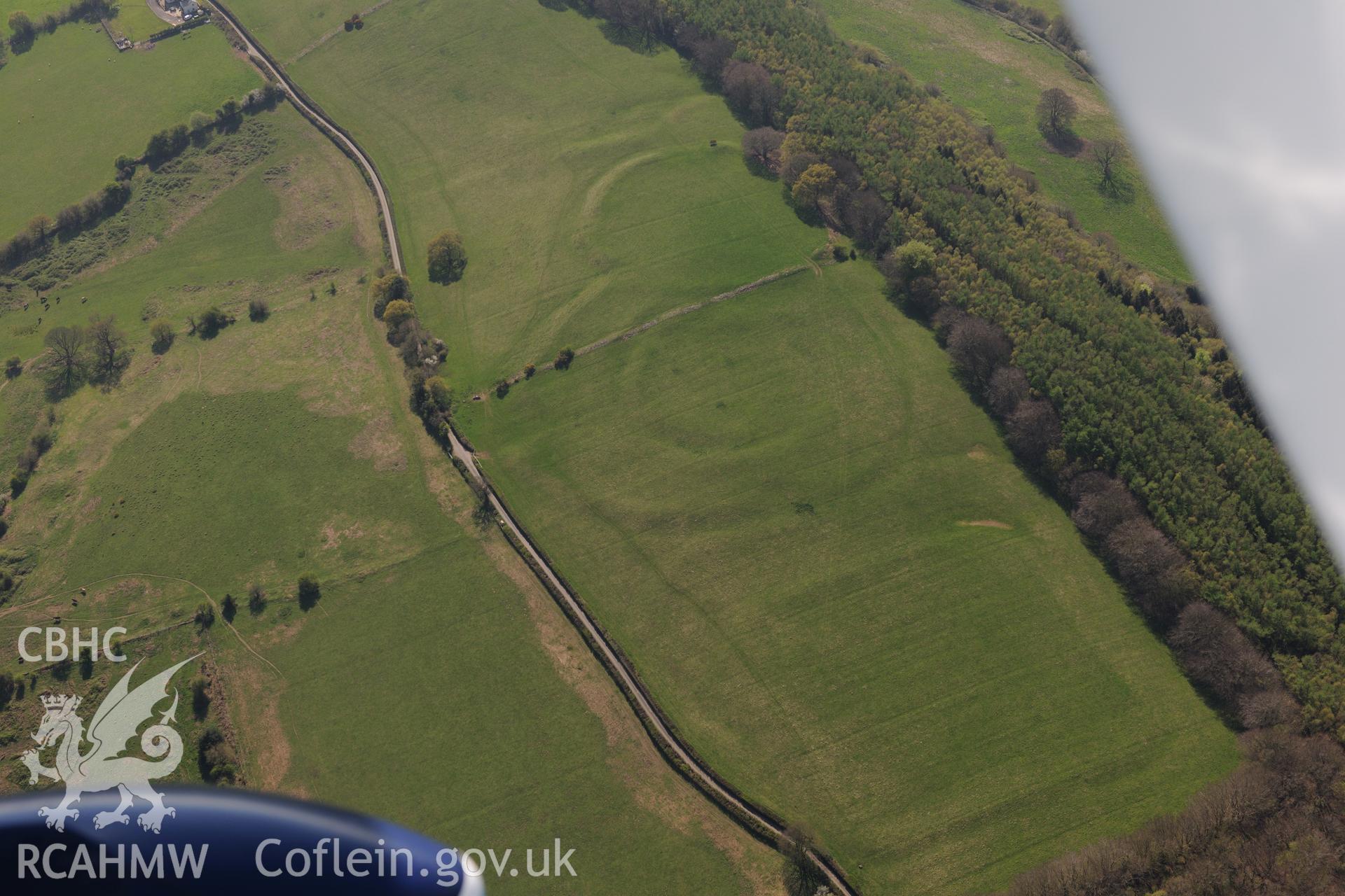 Coed-y-Caerau Enclosures and Pen Toppen Ash Roman Fort. Oblique aerial photograph taken during the Royal Commission's programme of archaeological aerial reconnaissance by Toby Driver on 21st April 2015