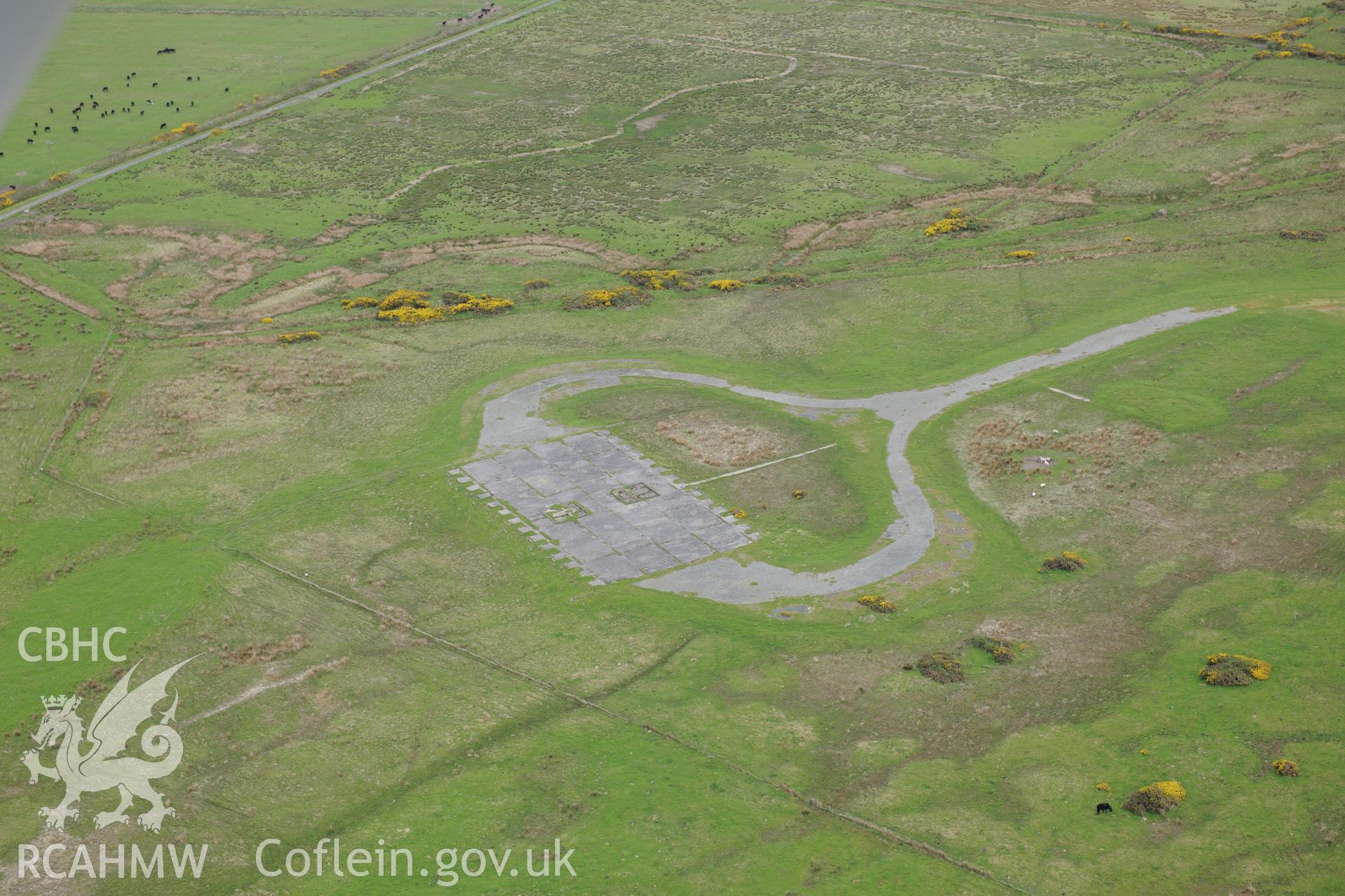 Structures at Caernarfon airfield. Oblique aerial photograph taken during the Royal Commission?s programme of archaeological aerial reconnaissance by Toby Driver on 22nd May 2013.