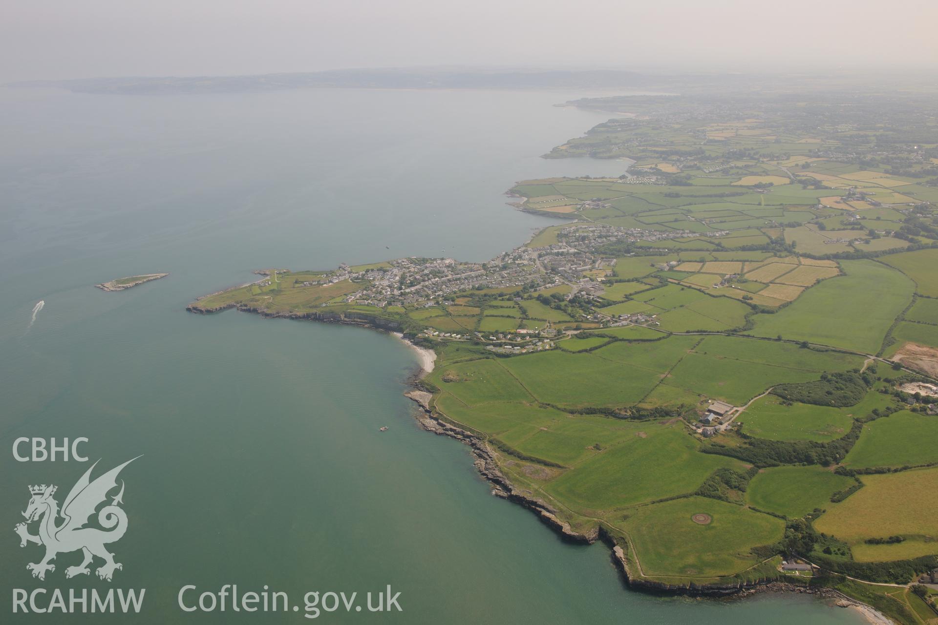 The town of Moelfre, on the east coast of Anglesey. Oblique aerial photograph taken during the Royal Commission?s programme of archaeological aerial reconnaissance by Toby Driver on 12th July 2013.