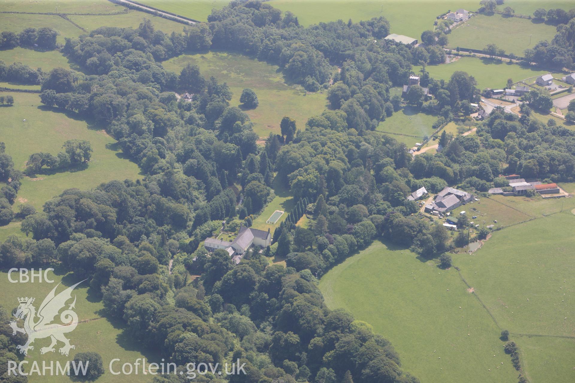 Bodfean Hall and its associated grounds and gardens, north west of Pwllheli, on the Lleyn Peninsula. Oblique aerial photograph taken during the Royal Commission?s programme of archaeological aerial reconnaissance by Toby Driver on 12th July 2013.