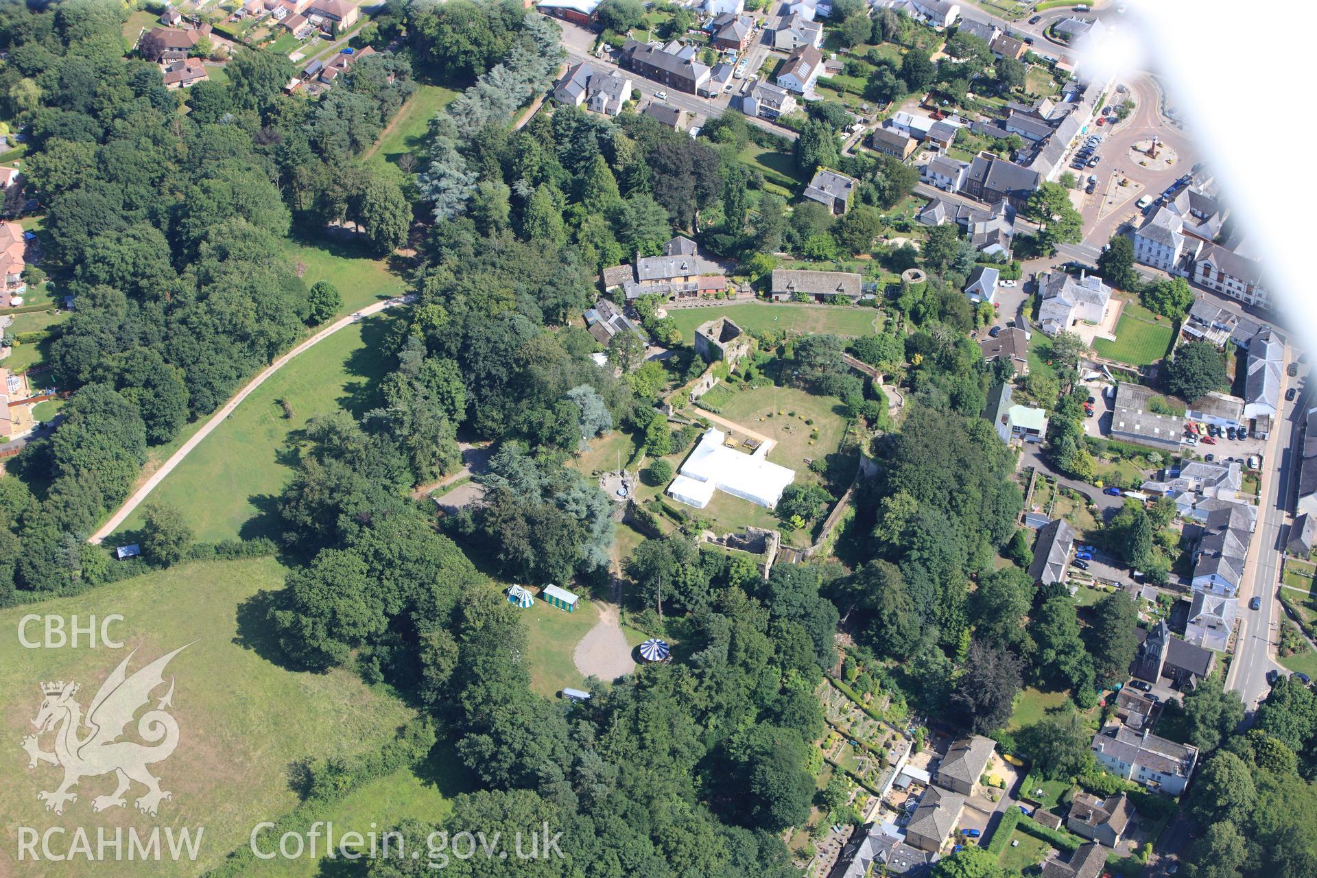 Usk Castle, Castle House and Usk Castle Garden, Usk. Oblique aerial photograph taken during the Royal Commission?s programme of archaeological aerial reconnaissance by Toby Driver on 1st August 2013.