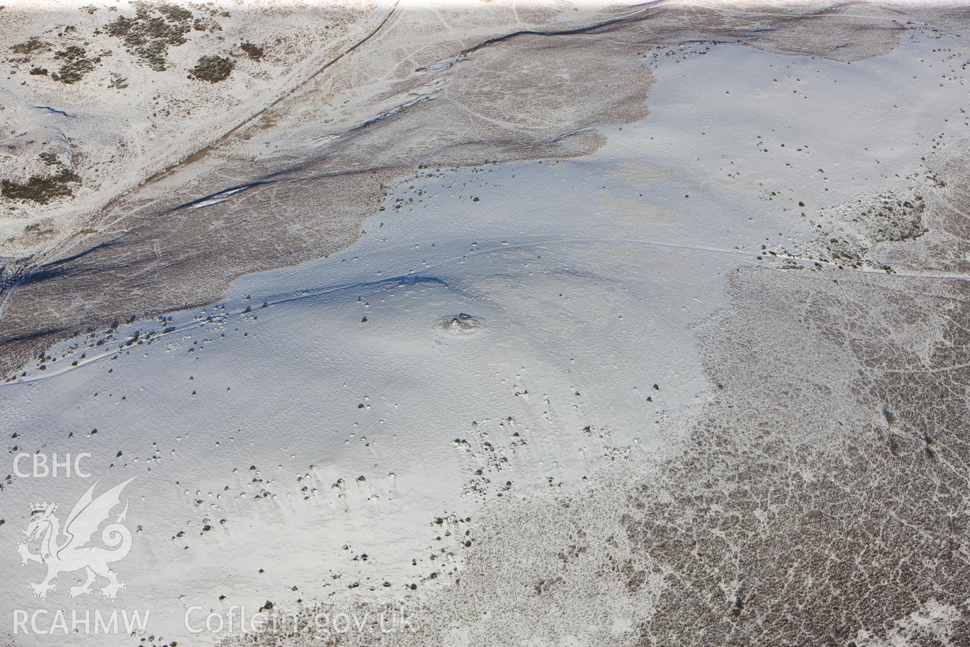 Carneddau hill cairn, north east of Builth Wells. Oblique aerial photograph taken during the Royal Commission?s programme of archaeological aerial reconnaissance by Toby Driver on 15th January 2013.