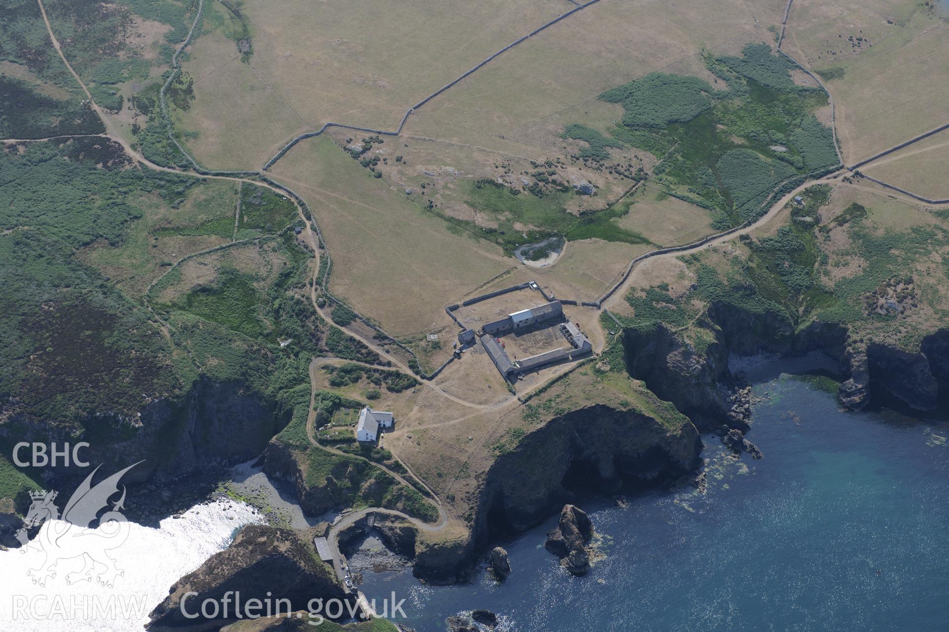 Ramsey Island Farm and pond, on Ramsey Island. Oblique aerial photograph taken during the Royal Commission?s programme of archaeological aerial reconnaissance by Toby Driver on 16th July 2013.