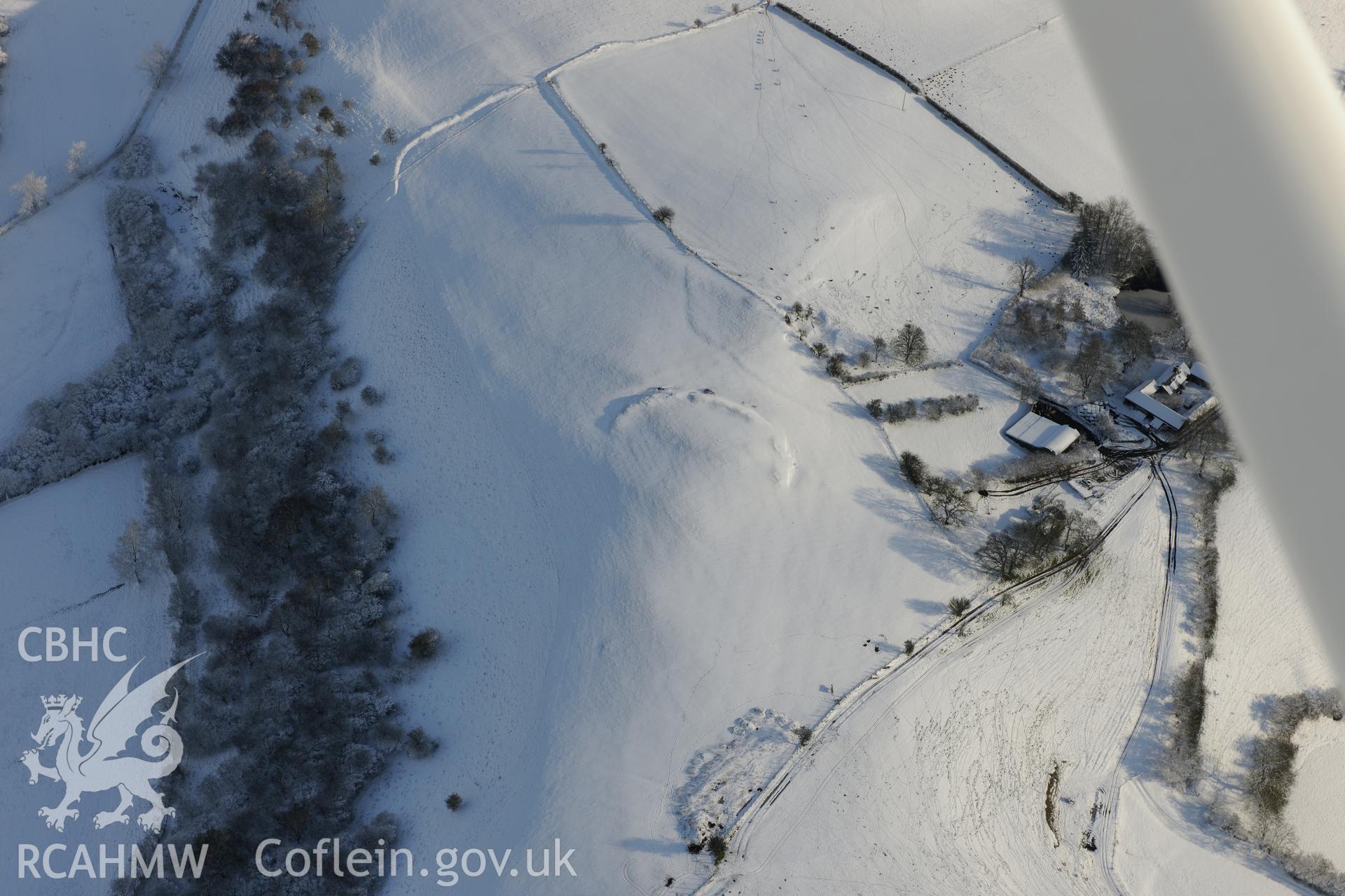 Castell Crugerydd motte and bailey, south east of Llandrindod Wells. Oblique aerial photograph taken during the Royal Commission?s programme of archaeological aerial reconnaissance by Toby Driver on 15th January 2013.