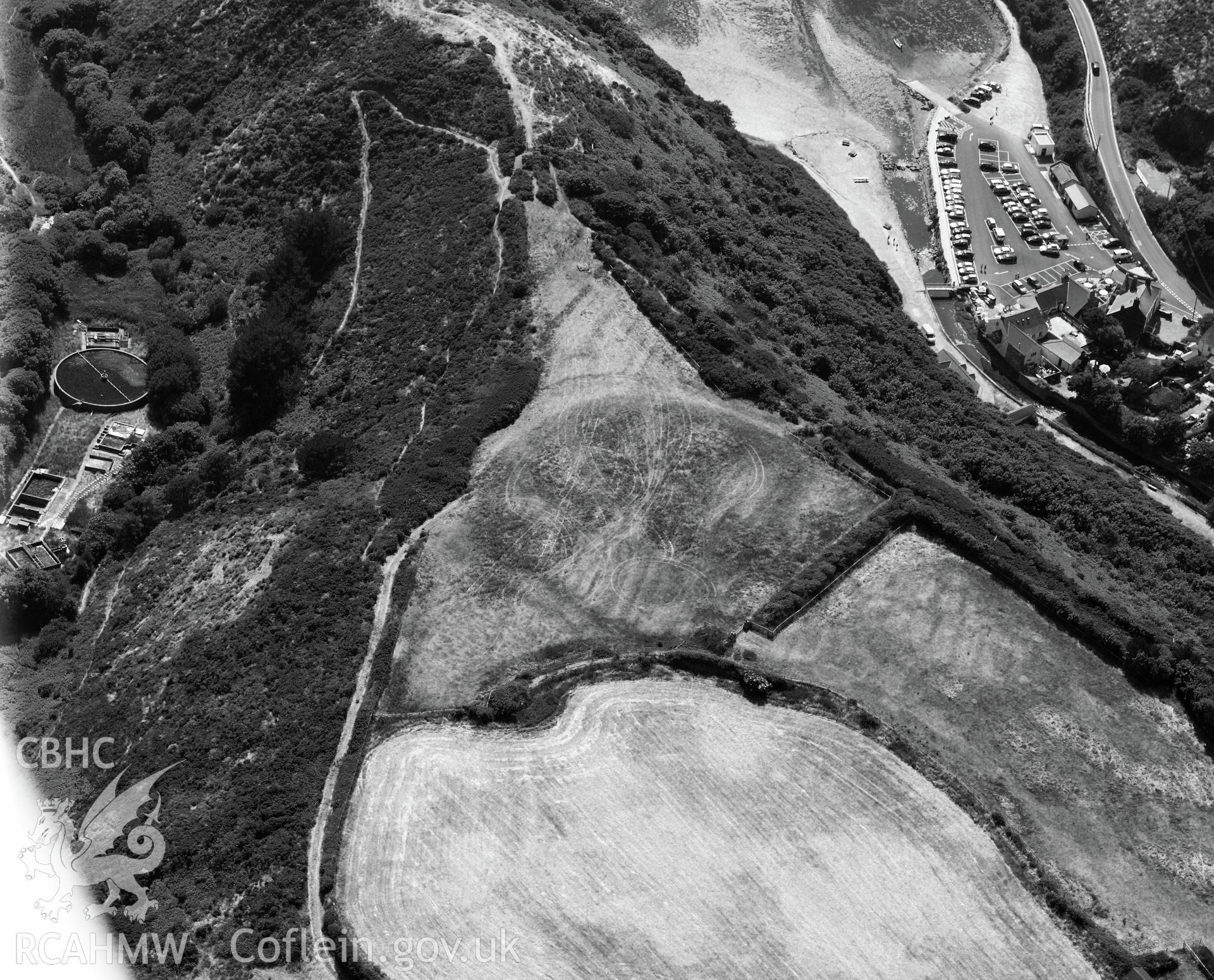 Defended enclosure at Solva. Oblique aerial photograph taken during the Royal Commission?s programme of archaeological aerial reconnaissance by Toby Driver on 16th July 2013.