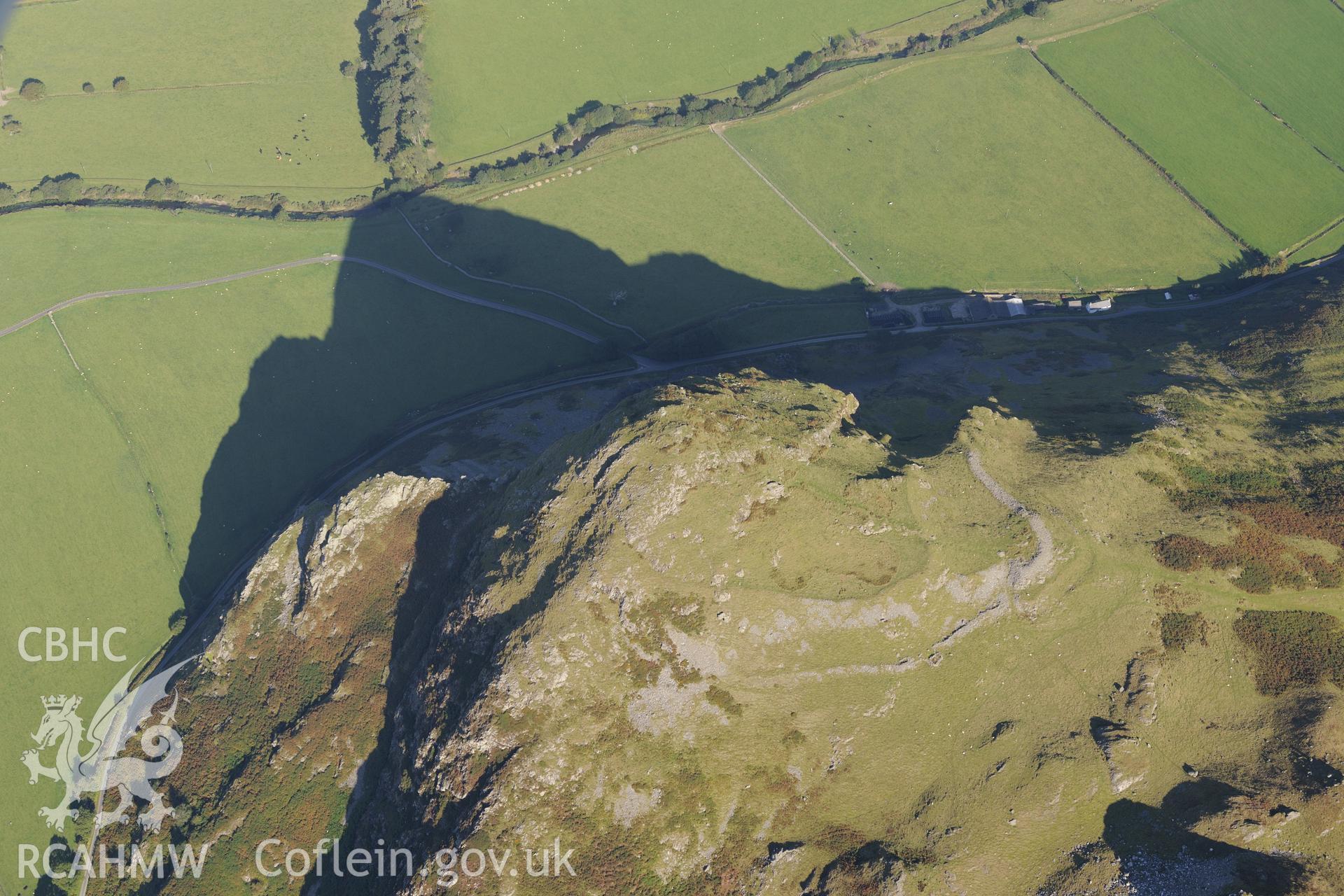 Hillfort on Bird's Rock, near Abergynolwyn. Oblique aerial photograph taken during the Royal Commission's programme of archaeological aerial reconnaissance by Toby Driver on 2nd October 2015.