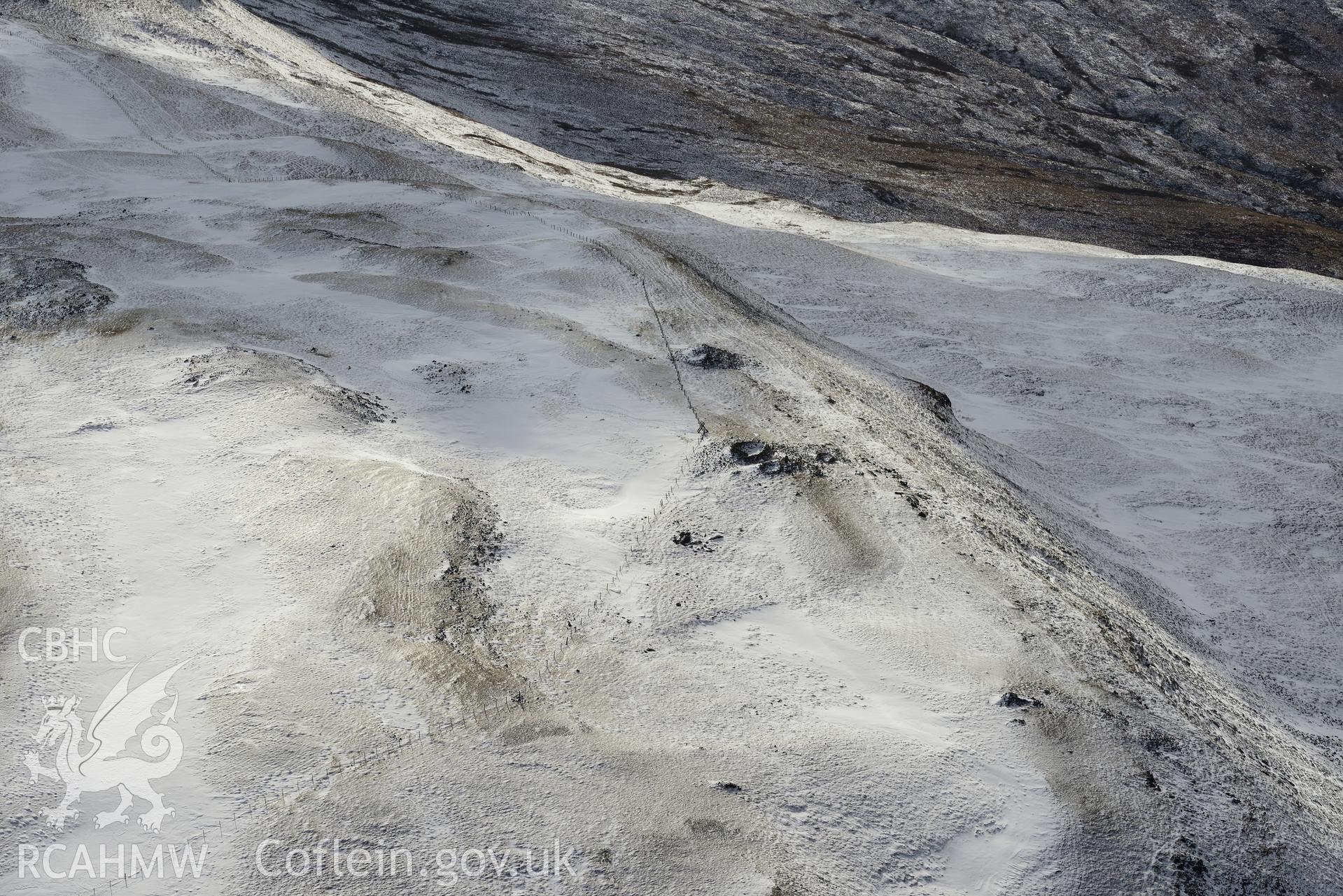 Pen Plynlimon Fawr central cairn, between Aberystwyth and Llangurig. Oblique aerial photograph taken during the Royal Commission's programme of archaeological aerial reconnaissance by Toby Driver on 4th February 2015.