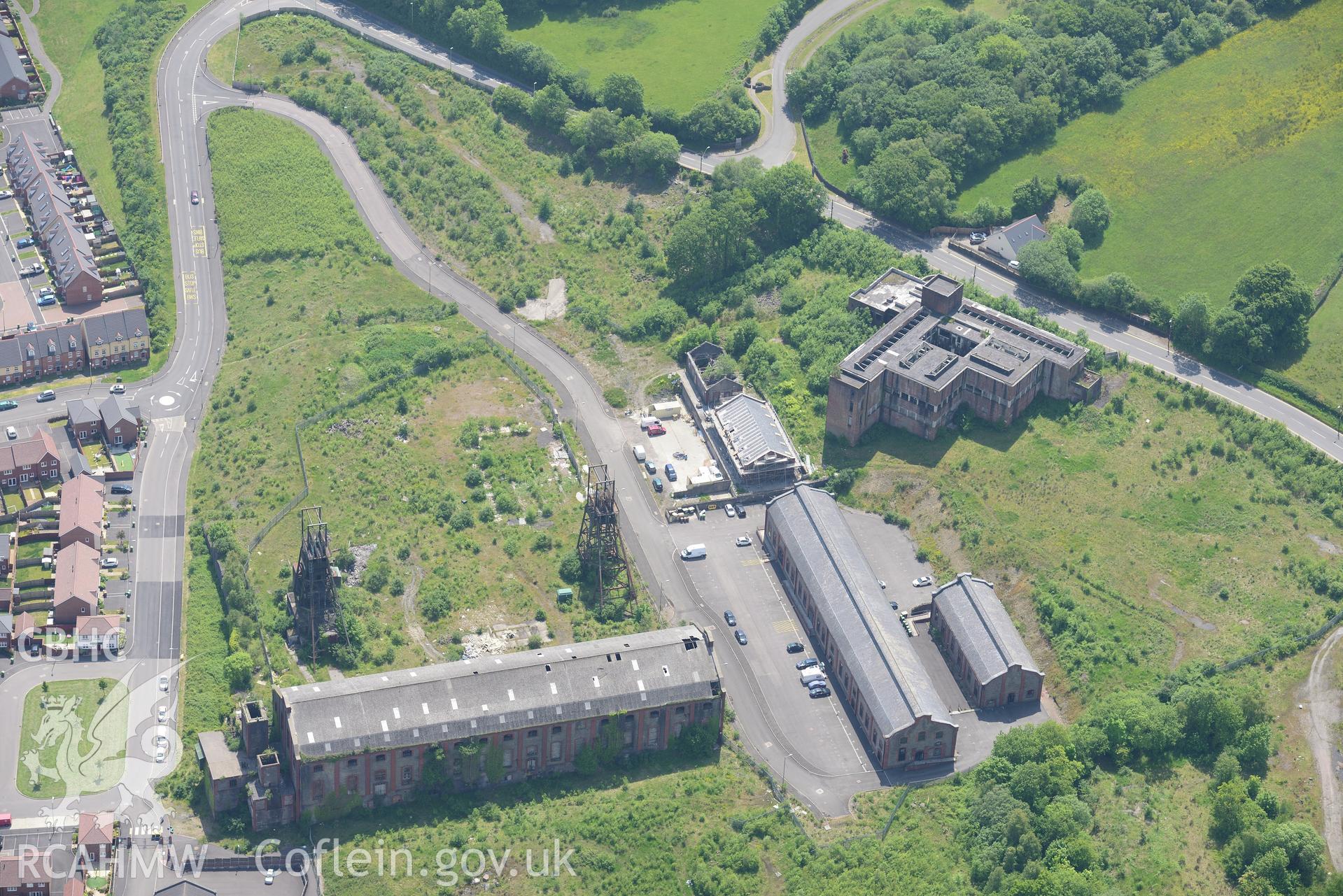 Penallta Colliery, Ystrad Mynach, including views of headframe shafts no. 1 and 2; pithead baths and canteen, powerhouse and workshops. Oblique aerial photograph taken during the Royal Commission's programme of archaeological aerial reconnaissance by Toby Driver on 11th June 2015.