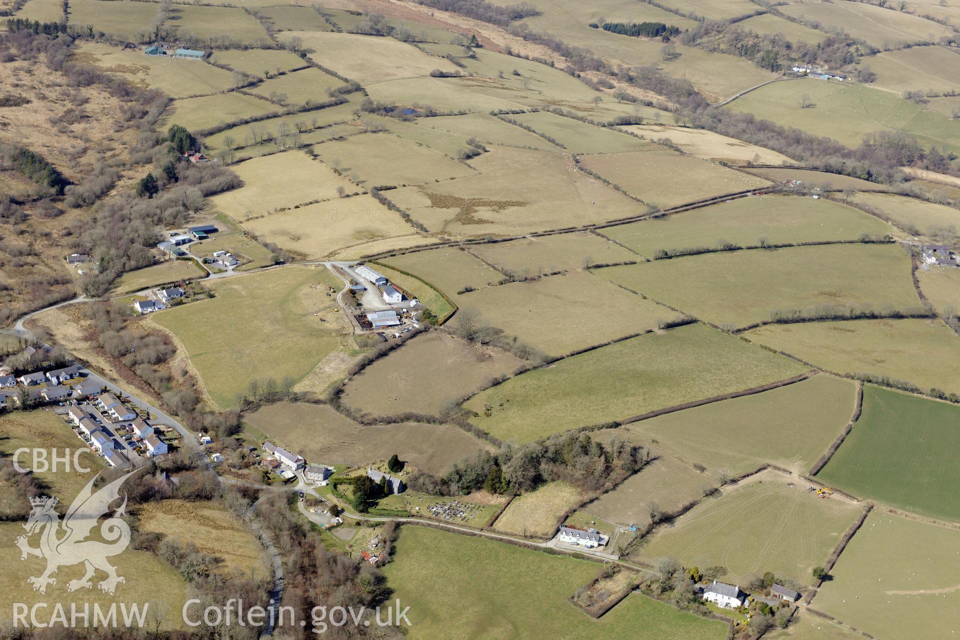 The village of Silian, north of Lampeter. Oblique aerial photograph taken during the Royal Commission?s programme of archaeological aerial reconnaissance by Toby Driver on 2nd April 2015.