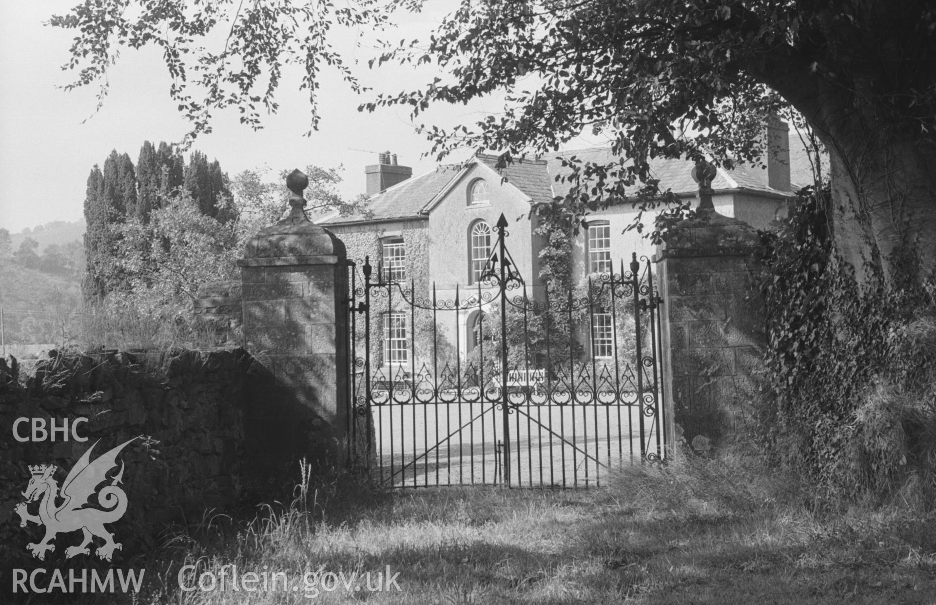 Digital copy of a black and white negative showing ornate iron gates on the south side of Llanfair House, Llandysul. Photographed by Arthur O. Chater in August 1965 from Grid Reference SN 4333 4083, looking north.