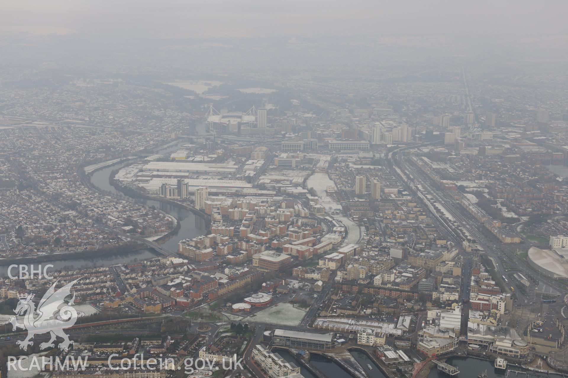 Cardiff, with Techniquest in the foreground and Cardiff Millennium Stadium in the distance. Oblique aerial photograph taken during the Royal Commission?s programme of archaeological aerial reconnaissance by Toby Driver on 24th January 2013.