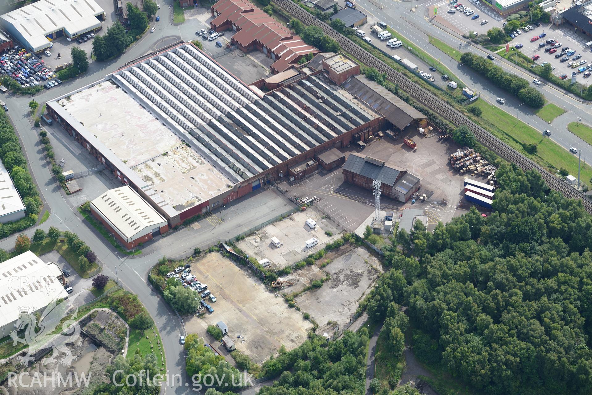 Ashmount Centre (formerly an alkali works, then a textile factory), Flint. Oblique aerial photograph taken during the Royal Commission's programme of archaeological aerial reconnaissance by Toby Driver on 11th September 2015.