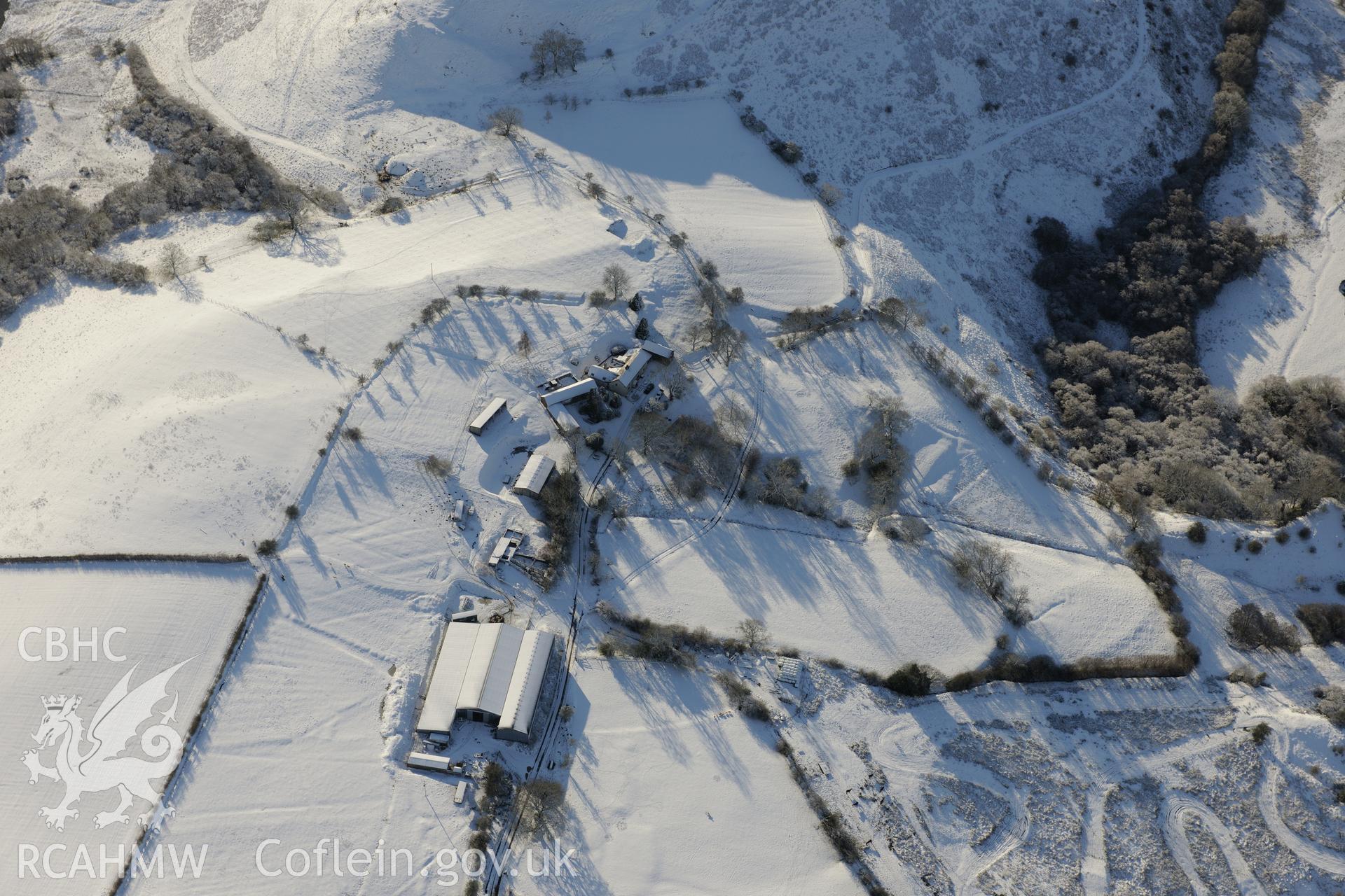 Earthworks of a longhouse and Cefnllys Castle deer park, Penybont, north east of Llandrindod Wells. Oblique aerial photograph taken during the Royal Commission?s programme of archaeological aerial reconnaissance by Toby Driver on 15th January 2013.