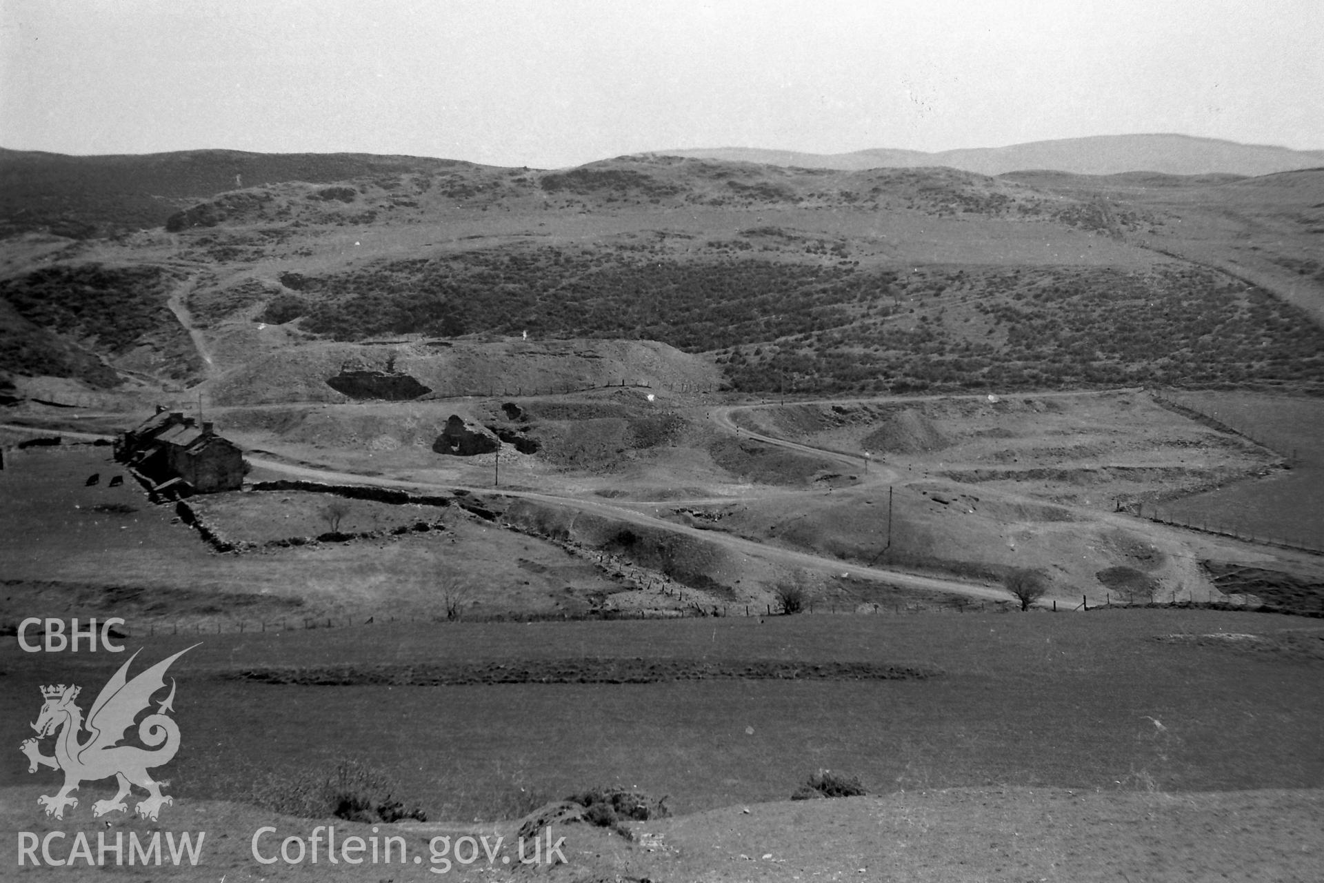 Digitised black & white photograph of Ystumtuen lead mine and dwellings. Produced during a Bachelor of Architecture dissertation entitled: 'The Form and Architecture of Nineteenth Century Industrial Settlements in Rural Wales' by Martin Davies, 1979.