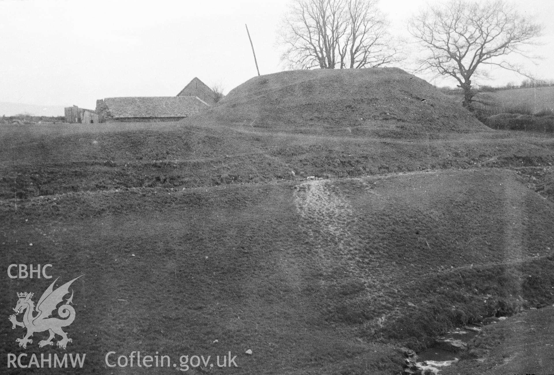 Digital copy of a nitrate negative showing Court Evan Gwynne Castle Mound. From Cadw Monuments in Care Collection.