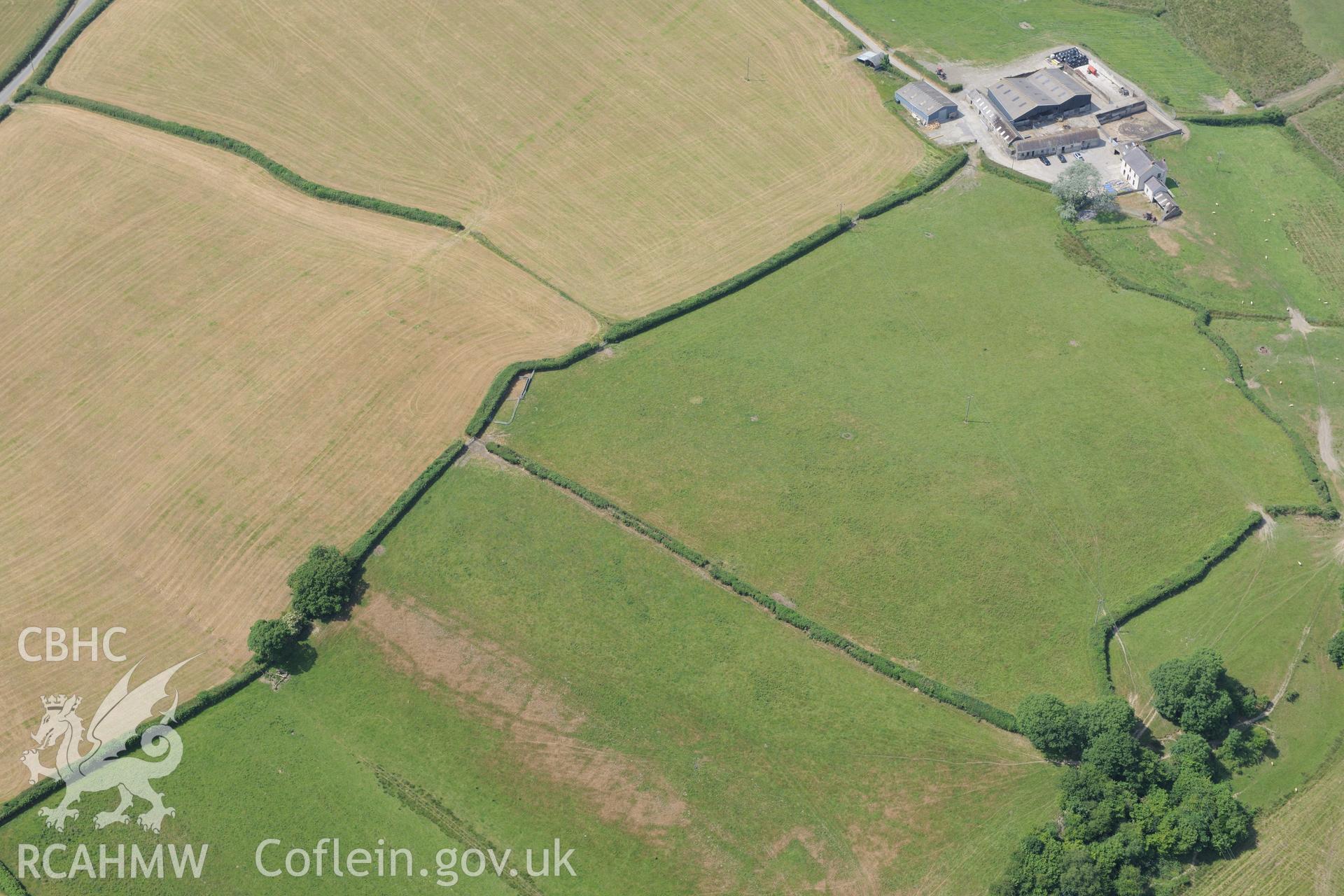Cropmark enclosure south of Blaen-Lliwe, north west of Whitland. Oblique aerial photograph taken during the Royal Commission?s programme of archaeological aerial reconnaissance by Toby Driver on 16th July 2013.