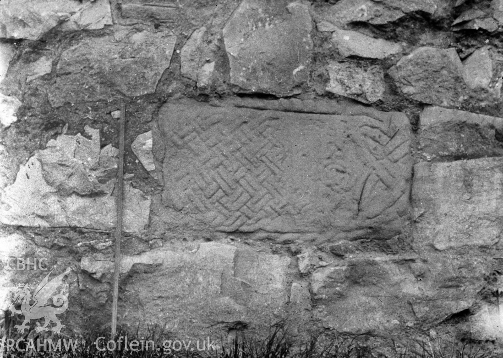 Digital copy of a nitrate negative showing view of inscribed stones in vicarage wall at the Friary near Rhuddlan Church,  taken by Leonard Monroe.