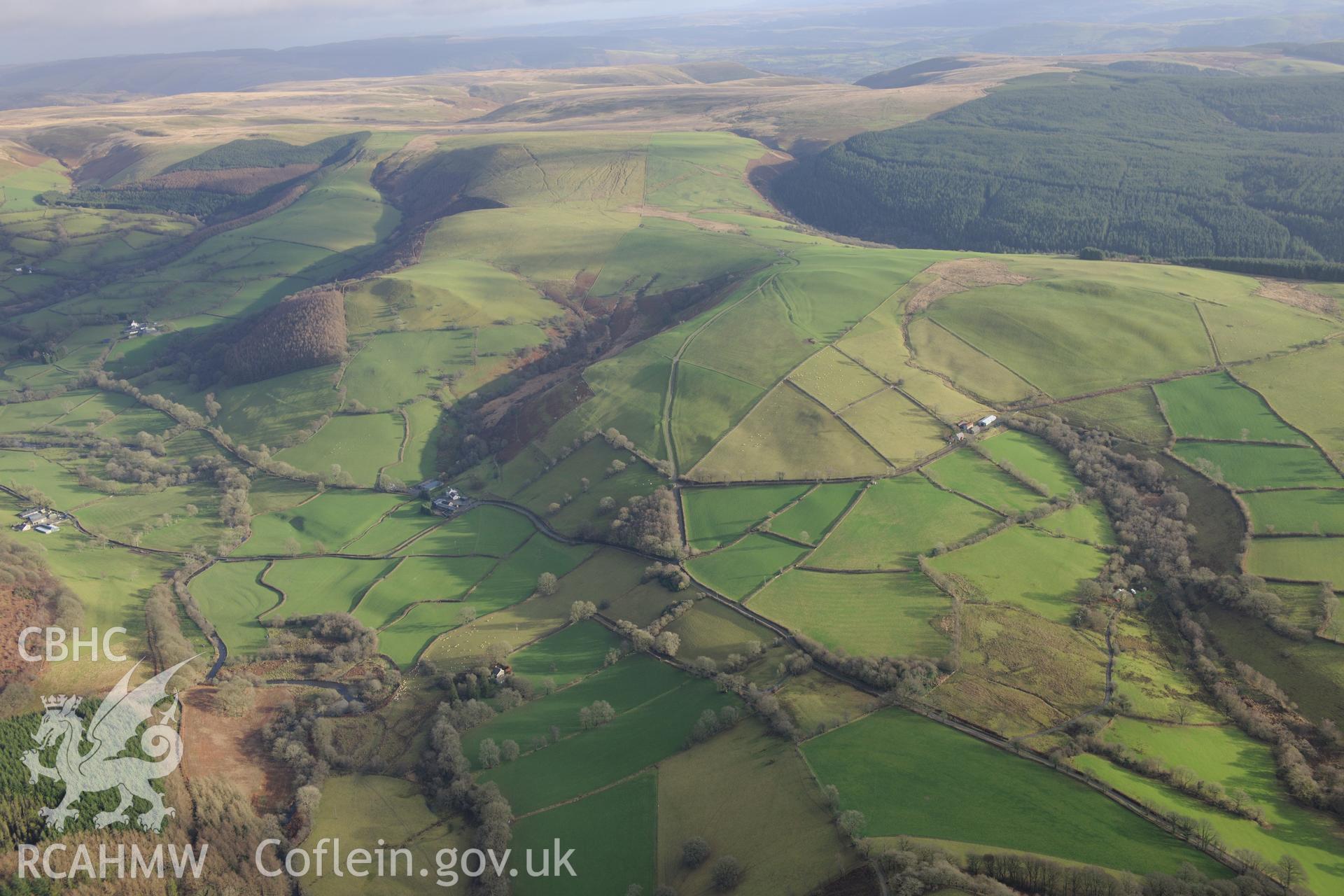 View of the Dolcothau landscape with Roman Aqueducts visible. Oblique aerial photograph taken during the Royal Commission's programme of archaeological aerial reconnaissance by Toby Driver on 6th January 2015.