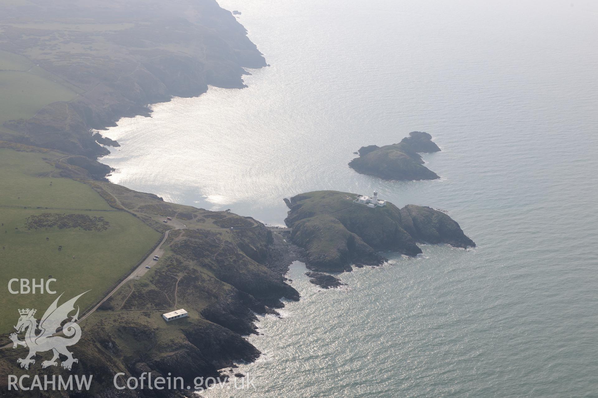 Aerial photography of Strumble Head lighthouse taken on 27th March 2017. Baseline aerial reconnaissance survey for the CHERISH Project. ? Crown: CHERISH PROJECT 2017. Produced with EU funds through the Ireland Wales Co-operation Programme 2014-2020. All material made freely available through the Open Government Licence.