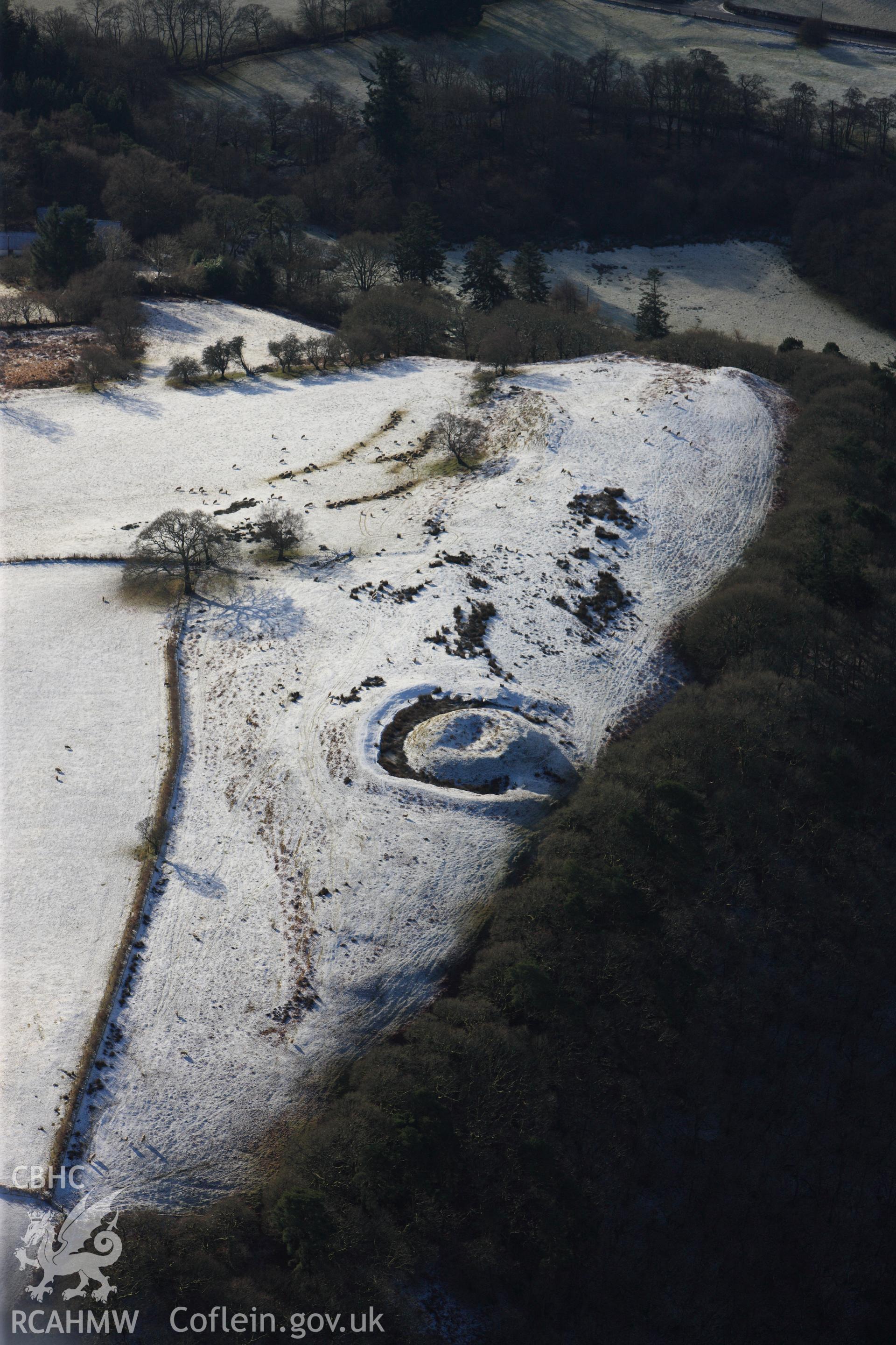 Fforest Castle and a house platform at Twdin Motte, north of Beulah, west of Builth Wells. Oblique aerial photograph taken during the Royal Commission?s programme of archaeological aerial reconnaissance by Toby Driver on 15th January 2013.