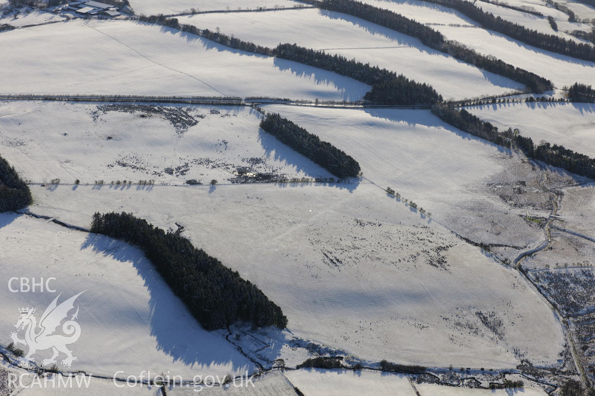 Section of Roman Road from Coelbren to Brecon Gaer, on the south western side of Mynydd Illtyd. Oblique aerial photograph taken during the Royal Commission?s programme of archaeological aerial reconnaissance by Toby Driver on 15th January 2013.