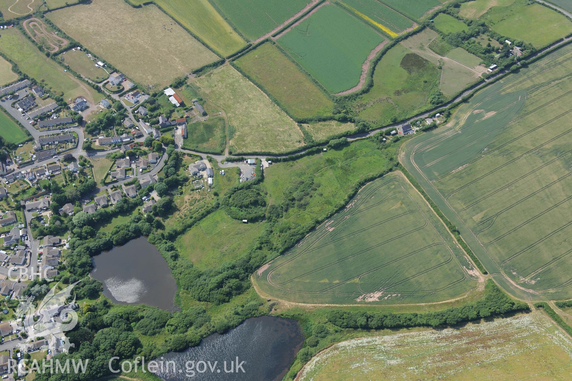 St Ishmael's Tump. Oblique aerial photograph taken during the Royal Commission?s programme of archaeological aerial reconnaissance by Toby Driver on 16th July 2013.