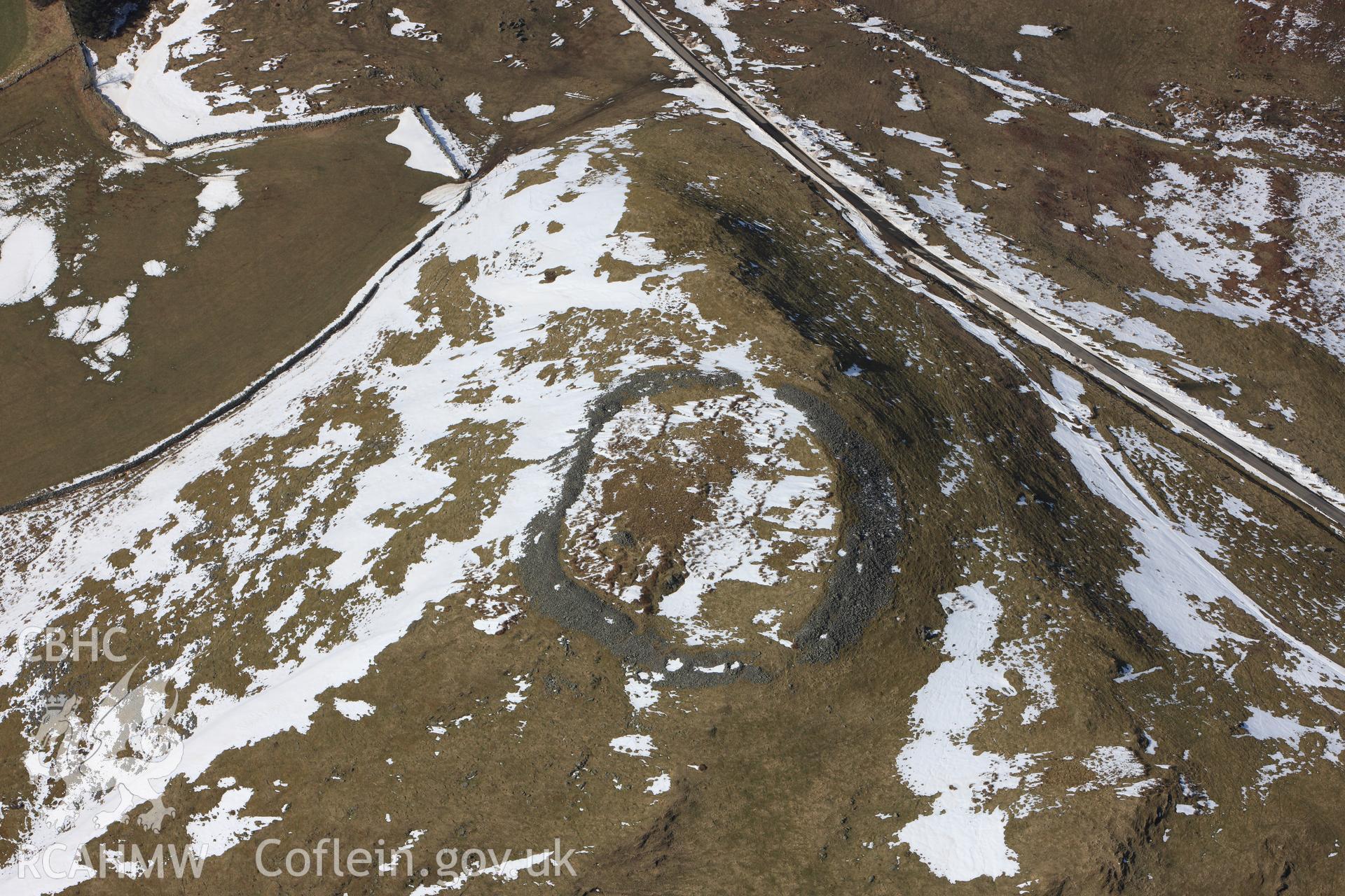 Pen-y-Gaer hillfort, north west of Llanidloes. Oblique aerial photograph taken during the Royal Commission's programme of archaeological aerial reconnaissance by Toby Driver on 2nd April 2013.