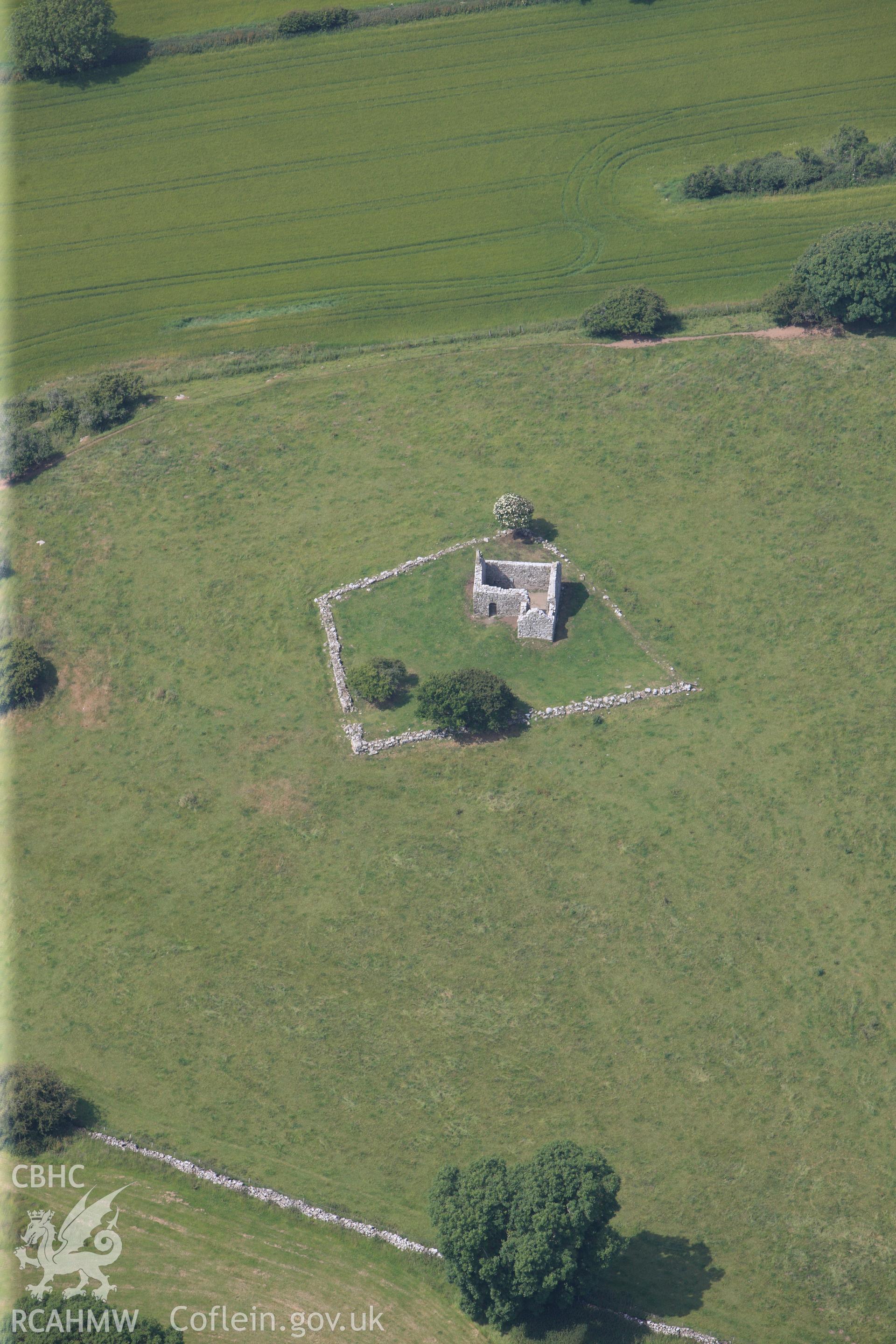 Capel Lligwy chapel of ease, inland of Moelfre, Anglesey. Oblique aerial photograph taken during the Royal Commission?s programme of archaeological aerial reconnaissance by Toby Driver on  12th July 2013.