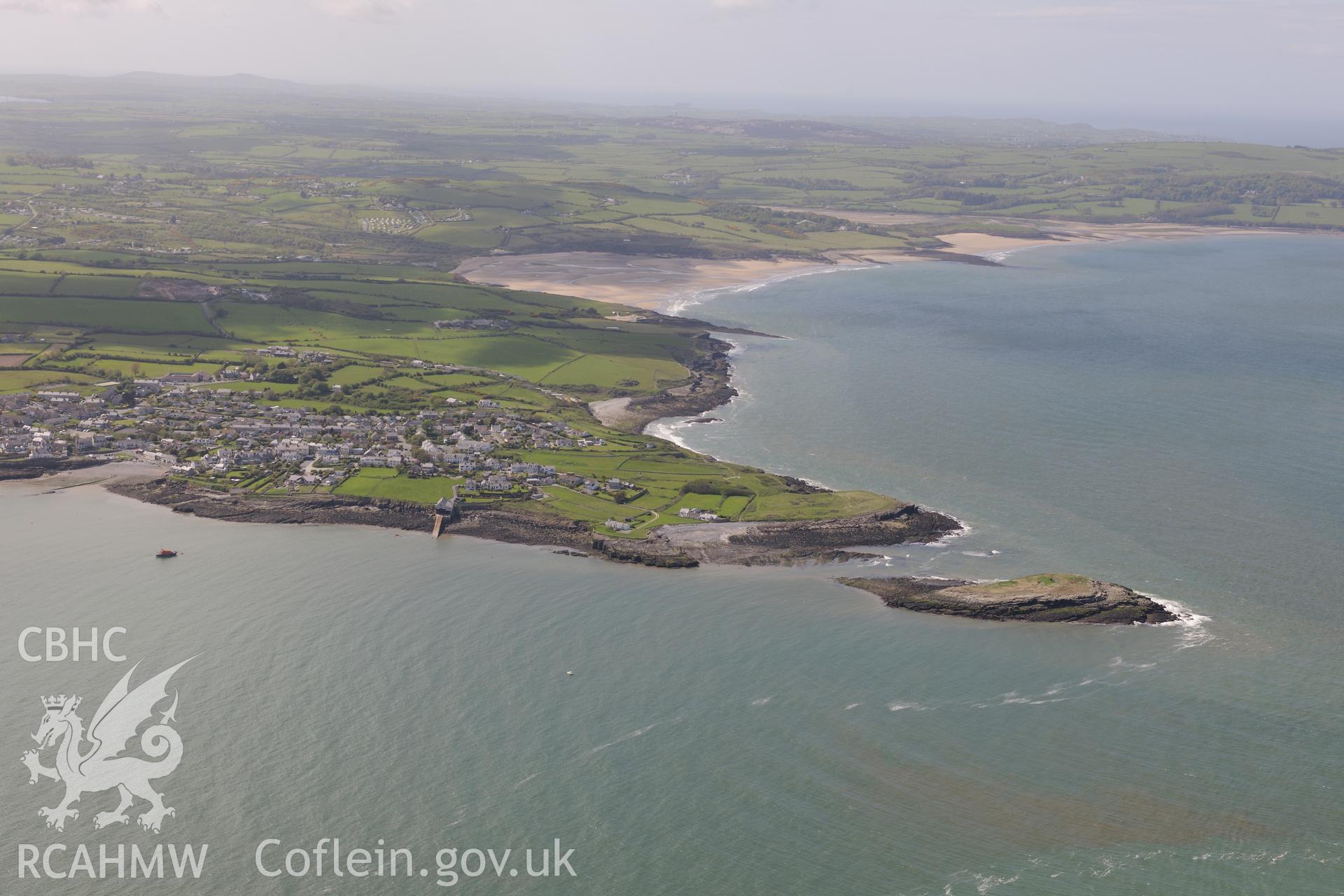 Moelfre, and the enclosure on Ynys Moelfre. Oblique aerial photograph taken during the Royal Commission?s programme of archaeological aerial reconnaissance by Toby Driver on 22nd May 2013.