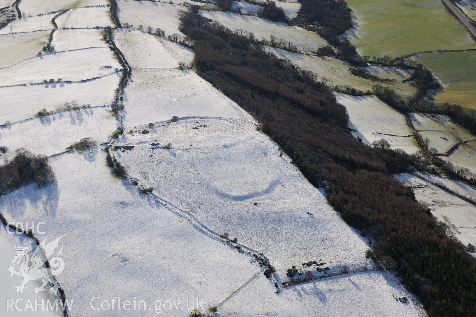 Twyn-y-Gaer enclosure, Defynnog, south east of Sennybridge. Oblique aerial photograph taken during the Royal Commission?s programme of archaeological aerial reconnaissance by Toby Driver on 15th January 2013.