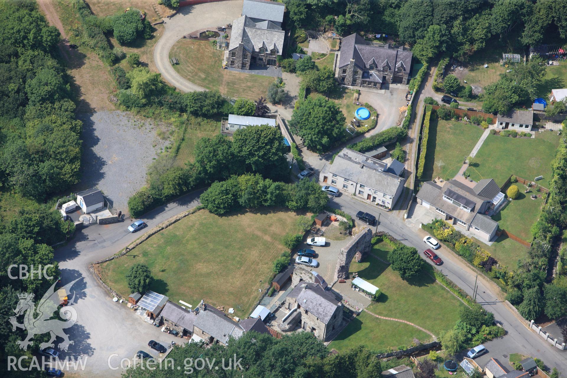 Priory of St Budoc and the Blessed Virgin, and Priory Farm, Milford Haven. Oblique aerial photograph taken during the Royal Commission?s programme of archaeological aerial reconnaissance by Toby Driver on 16th July 2013.