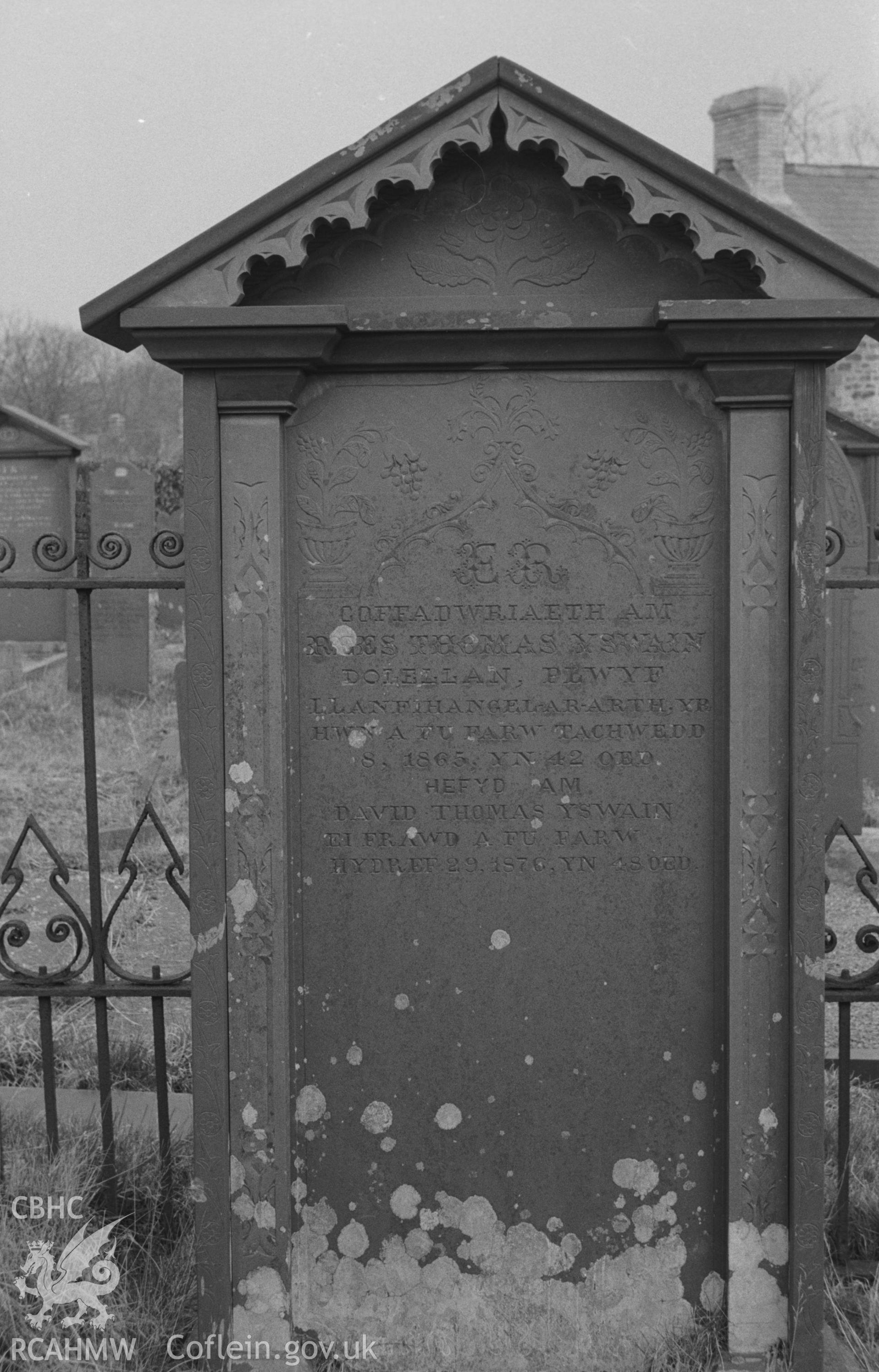 Digital copy of black & white negative showing gravestone in memory of members of the Thomas family of Dolellan at Capel Pant-y-Defaid, Prengwyn, Llandysul. Inside very fine wrought iron grave enclosures. Photograph by Arthur O. Chater on 11th April 1967.