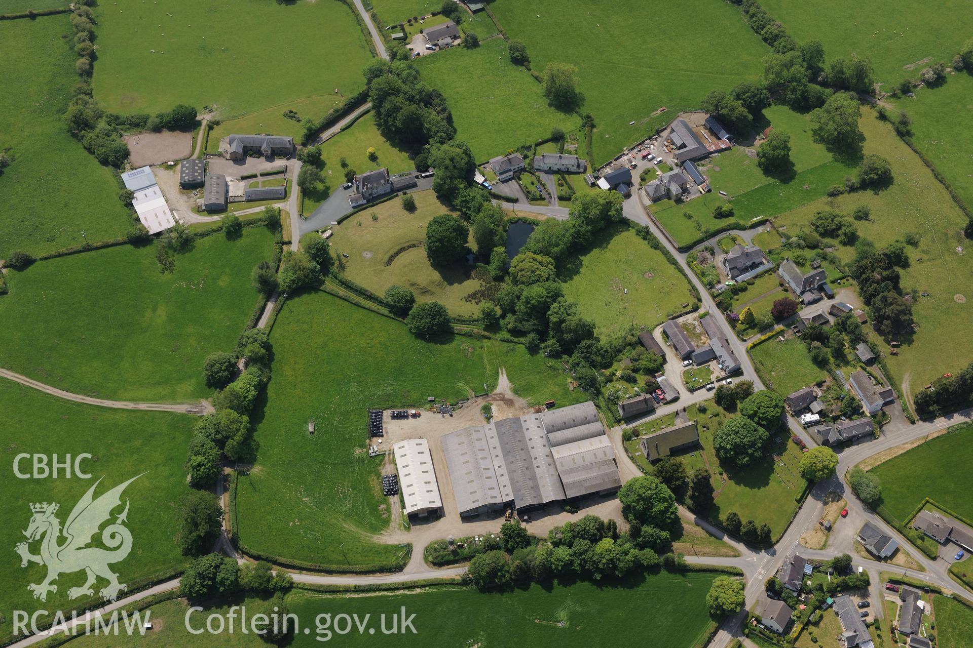 Kinnerton village, including views of Chapel House Farm; Kinnerton Court; Kinnerton Court Motte; St. Mary's Church and Upper House. Oblique aerial photograph taken during the Royal Commission's programme of archaeological aerial reconnaissance by Toby Driver on 11th June 2015.