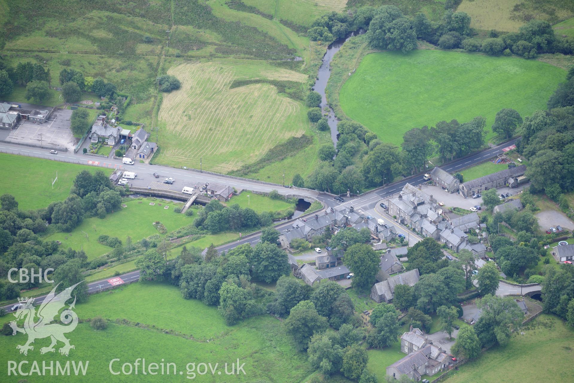 Pentrefoelas Parish Church and Voelas Arms Hotel. Oblique aerial photograph taken during the Royal Commission's programme of archaeological aerial reconnaissance by Toby Driver on 30th July 2015.