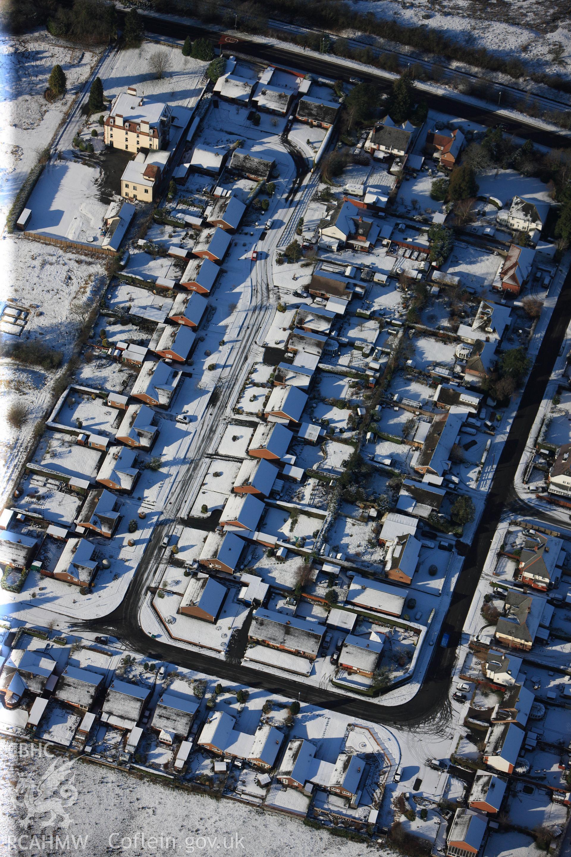 Housing on the southern outskirts of Llandrindod Wells. Oblique aerial photograph taken during the Royal Commission?s programme of archaeological aerial reconnaissance by Toby Driver on 15th January 2013.