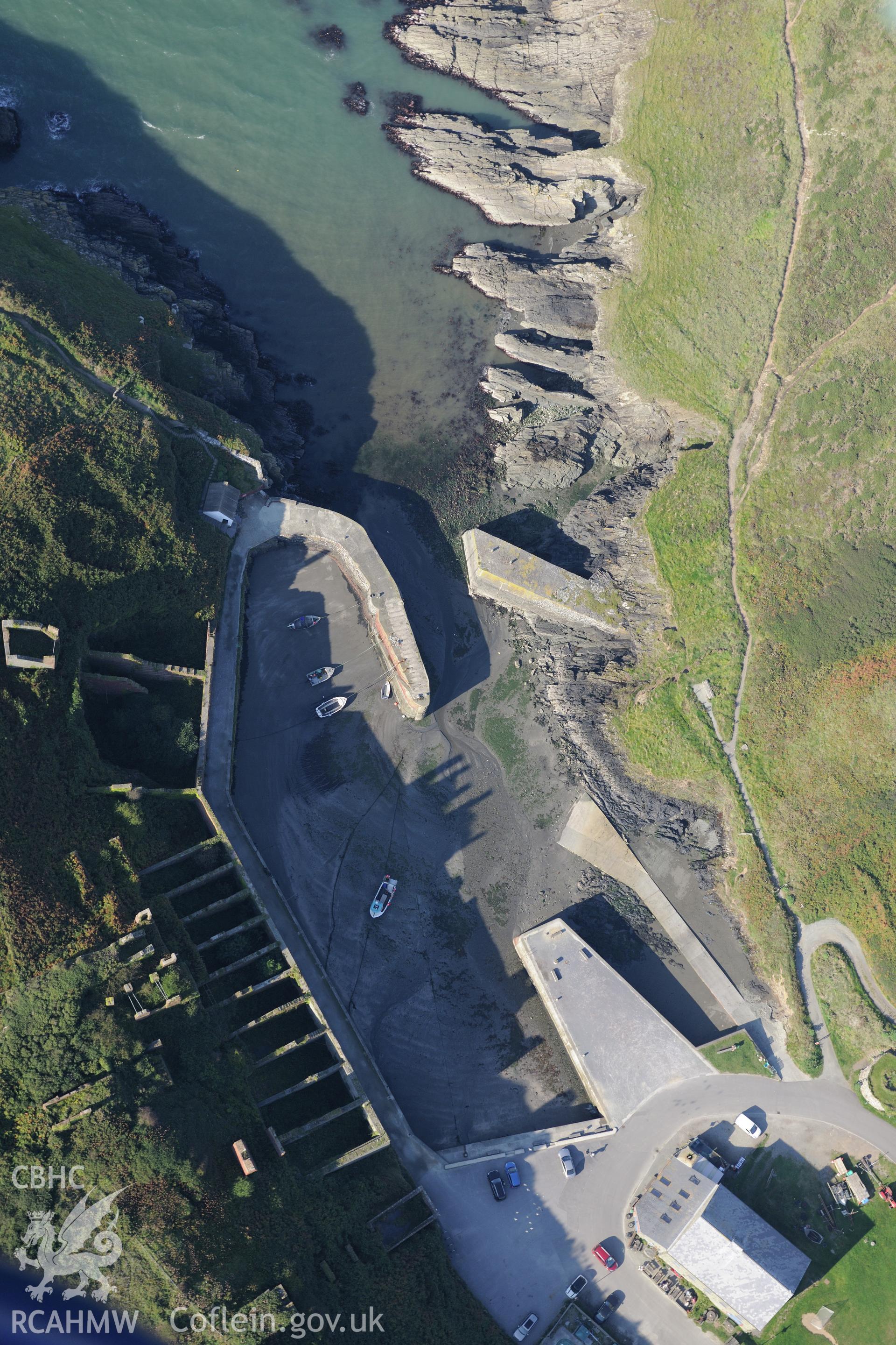 Remains of Porthgain quarry including the harbour and brickworks. Oblique aerial photograph taken during the Royal Commission's programme of archaeological aerial reconnaissance by Toby Driver on 30th September 2015.