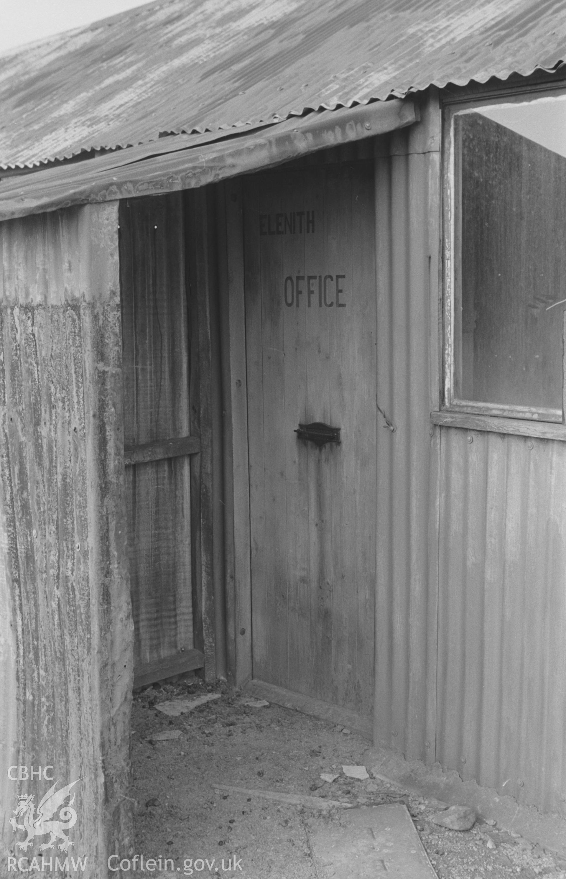 Digital copy of a black and white negative showing office doorway of the Elenith Mining Co., in corrugated iron shed, at the now deserted Esgair Mwyn Mine, Ystrad Fflur. Photographed by Arthur O. Chater in August 1966 from Grid Reference SN 755 692.