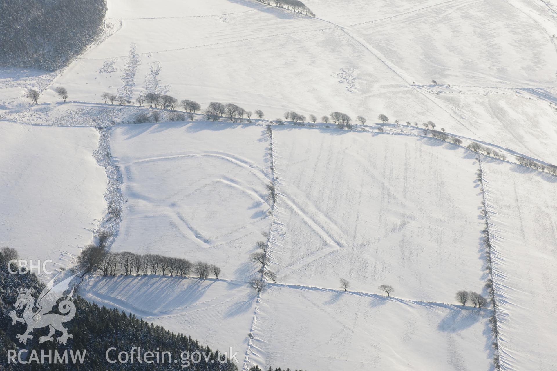 Moel Ton-Mawr hillfort and field system. Oblique aerial photograph taken during the Royal Commission?s programme of archaeological aerial reconnaissance by Toby Driver on 24th January 2013.