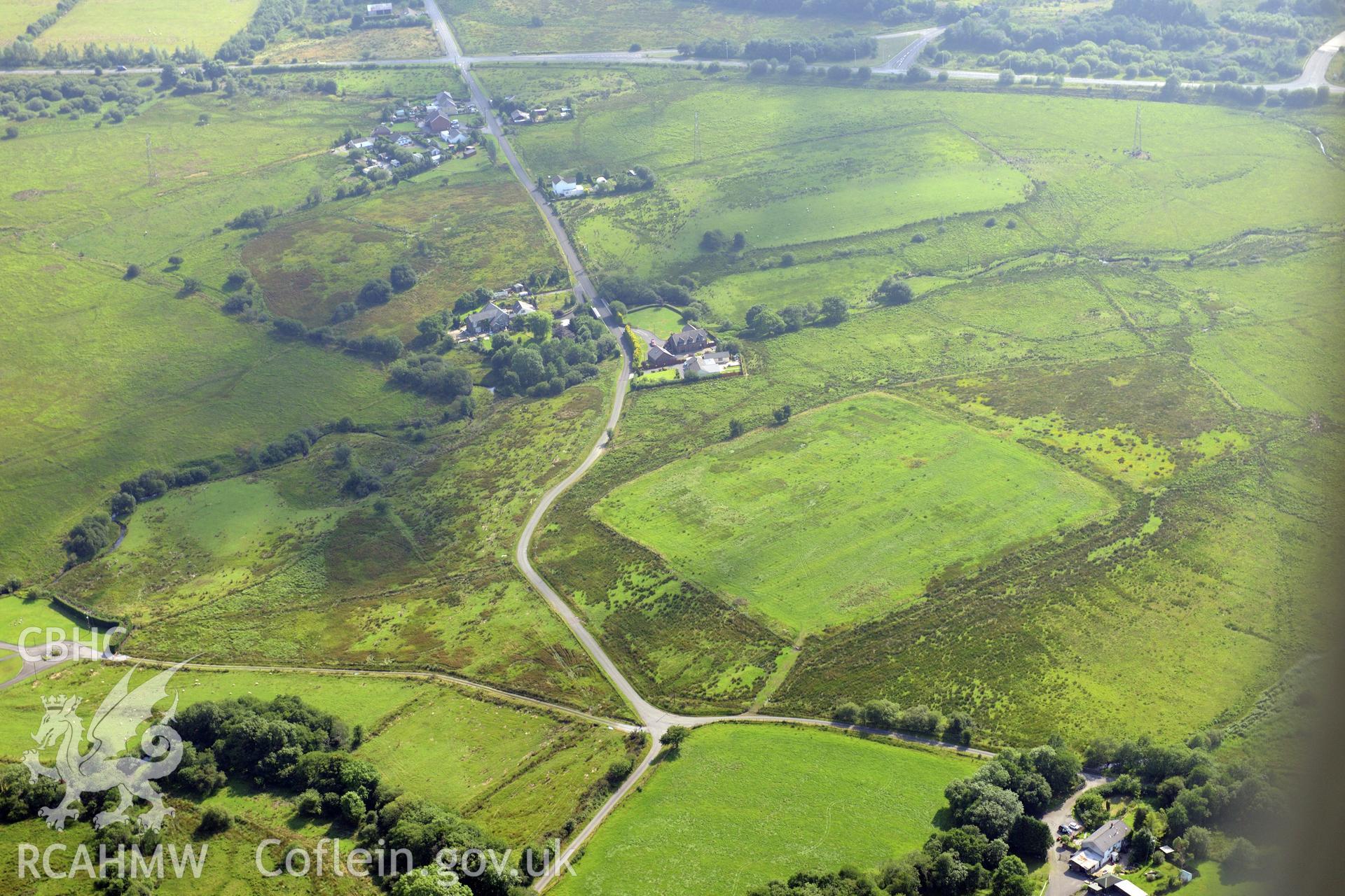 Coelbren roman fort, north east of Neath. Oblique aerial photograph taken during the Royal Commission?s programme of archaeological aerial reconnaissance by Toby Driver on 1st August 2013.