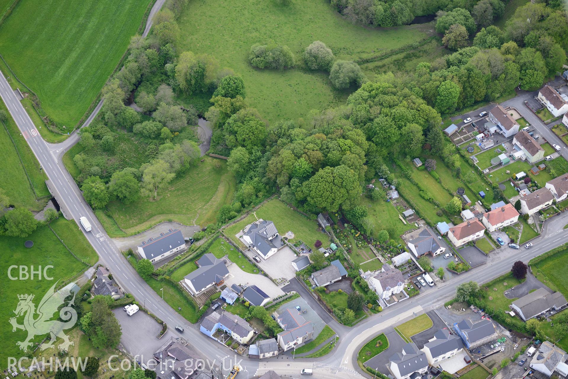 Llanwnnen castle and village. Oblique aerial photograph taken during the Royal Commission's programme of archaeological aerial reconnaissance by Toby Driver on 3rd June 2015.