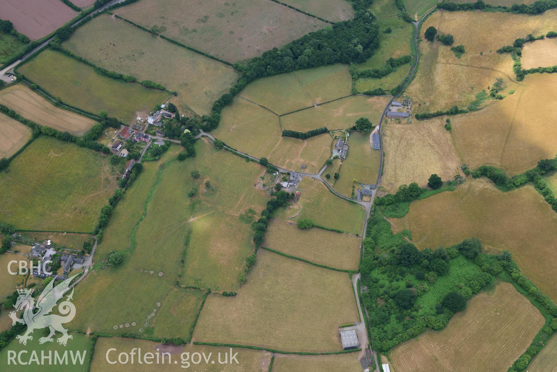 Royal Commission aerial photography of extensive parchmarks at Pen y Gaer Roman fort, including the internal plan and extramural buildings, taken on 19th July 2018 during the 2018 drought.