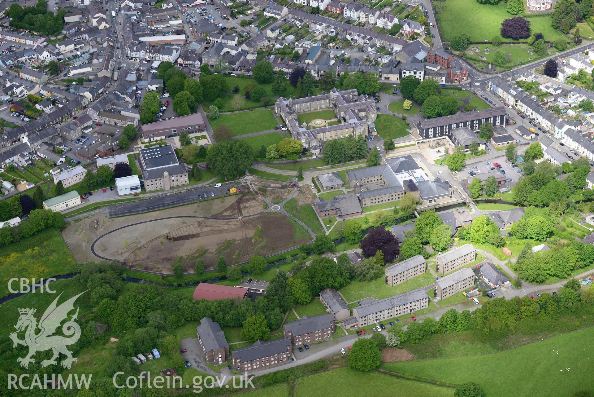 Stephen's castle, St David's college garden and the Roderic Bowen Library and Archives at Lampeter University. Oblique aerial photograph taken during the Royal Commission?s programme of archaeological aerial reconnaissance by Toby Driver on 3rd June 2015.