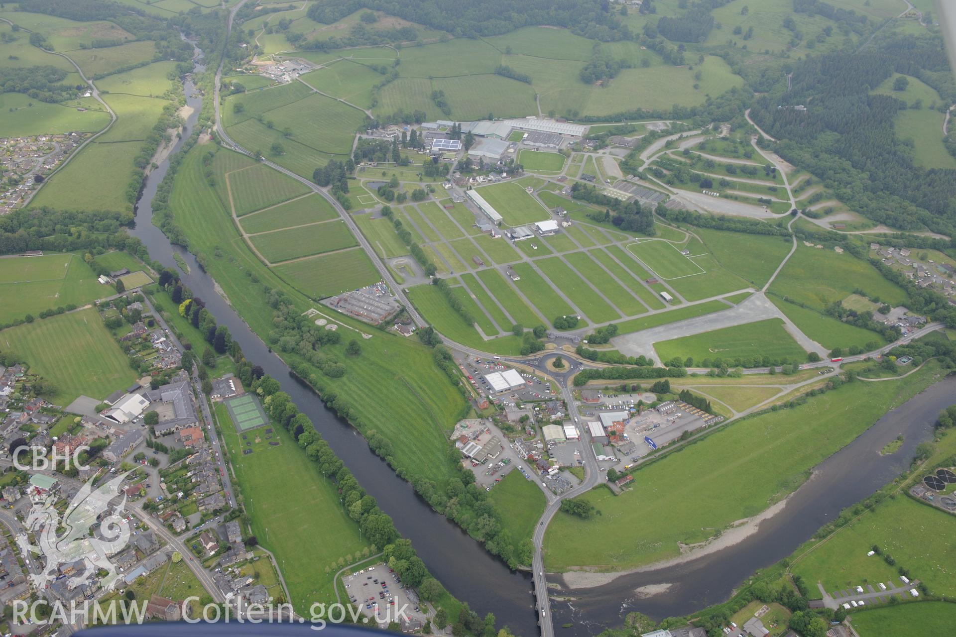 Royal Welsh Showground and the Builth bridge over the river Wye, Llanelwedd, Builth Wells. Oblique aerial photograph taken during the Royal Commission's programme of archaeological aerial reconnaissance by Toby Driver on 11th June 2015.