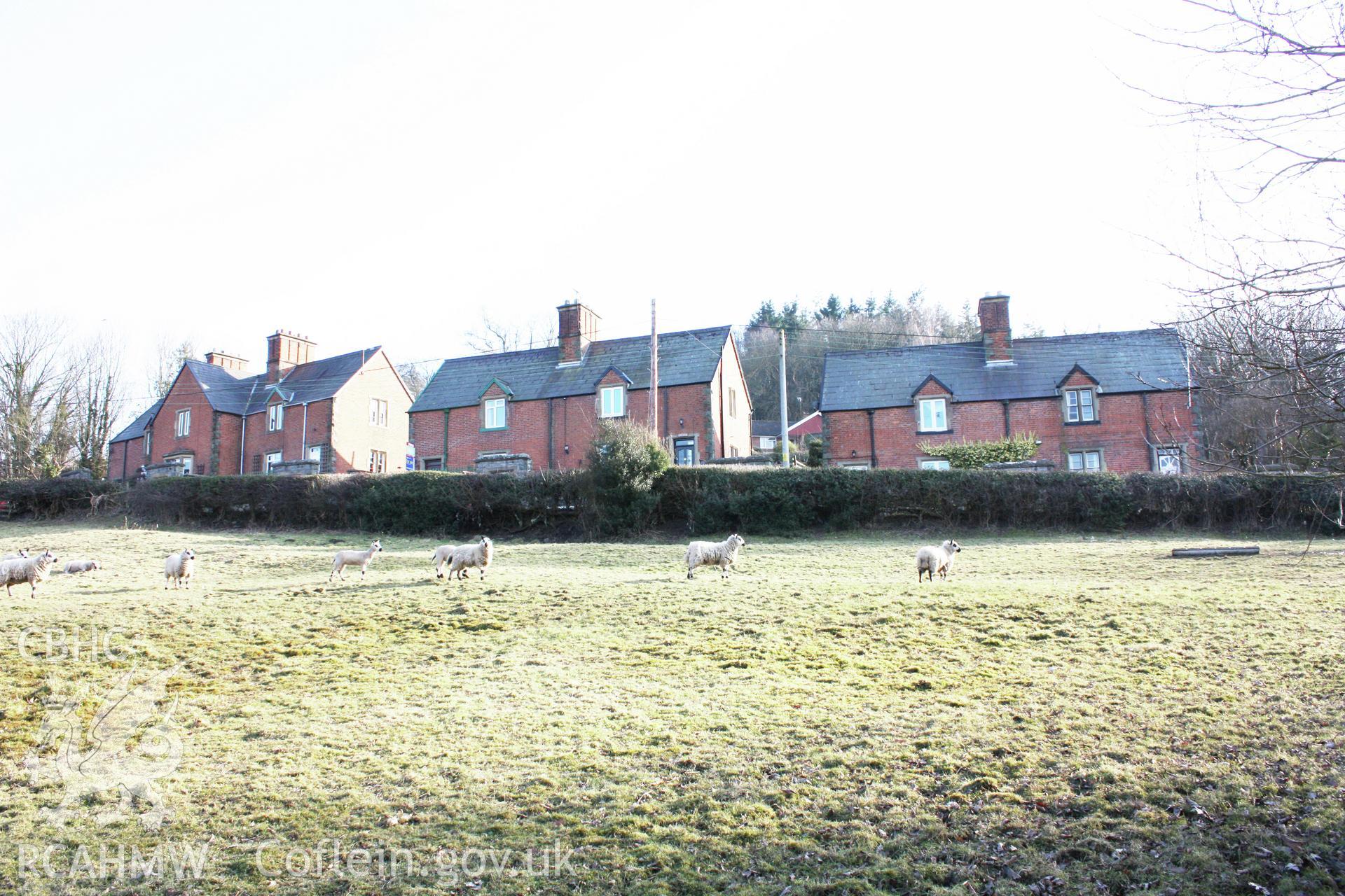 Colour photograph showing red brick exterior of Pentre Cottages, Leighton. Photographed during survey conducted by Geoff Ward on 11th July 2009.