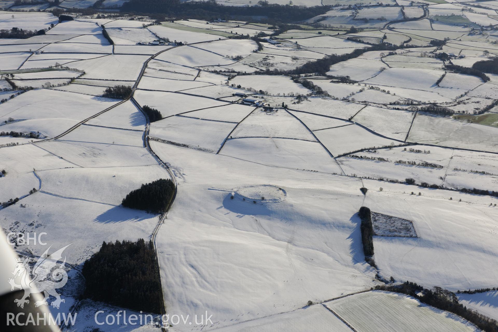 Twyn-y-Gaer defended enclosure. Oblique aerial photograph taken during the Royal Commission?s programme of archaeological aerial reconnaissance by Toby Driver on 15th January 2013.