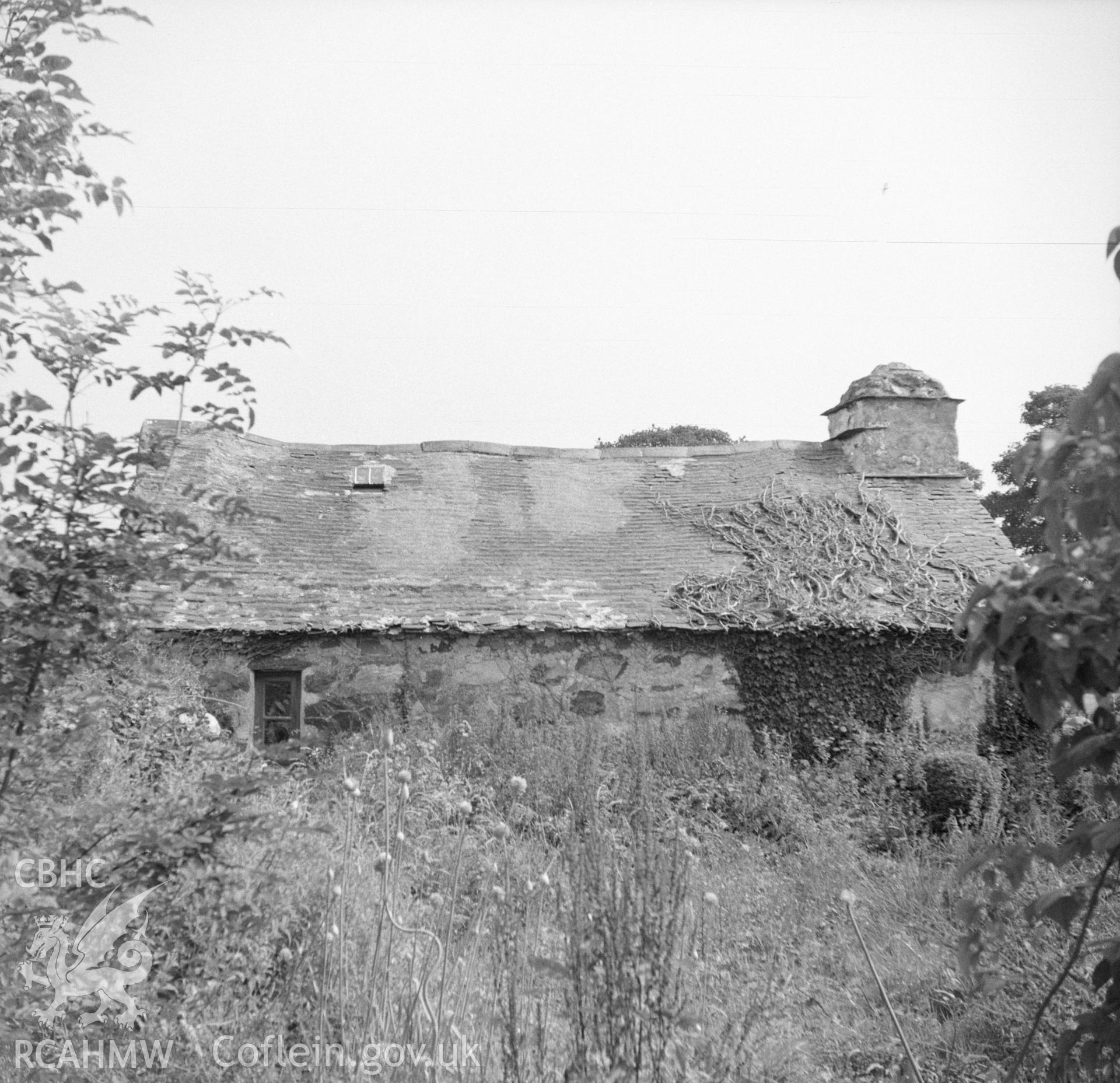 Digital copy of a nitrate negative showing exterior view of cottage to be relocated at the Folk Museum.